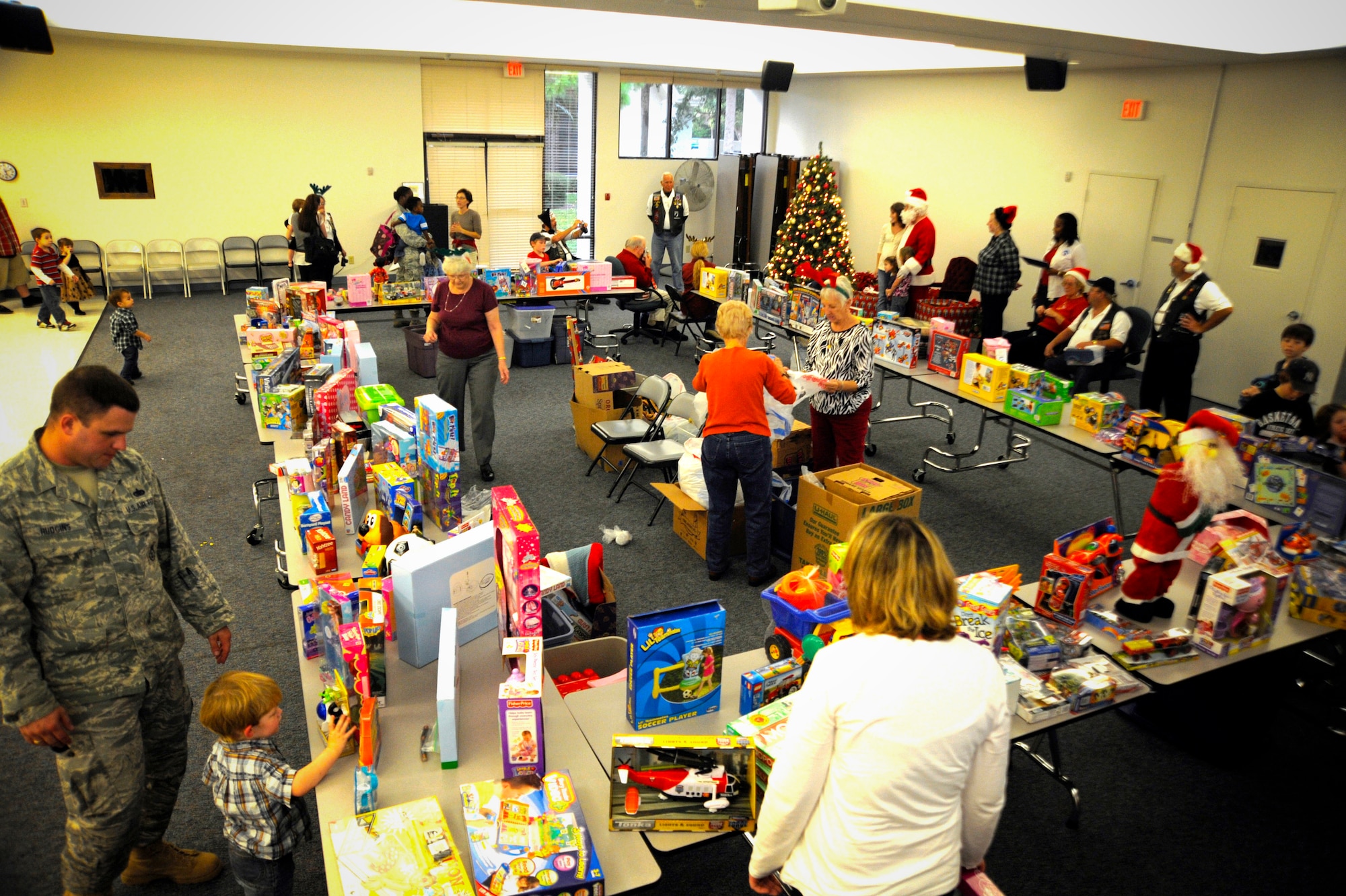 Ex-POW’s and Rolling Thunder teamed up to donate more than 300 toys and $5,000 in cash to military families for Christmas. The event was sponsored on base by the Airman & Family Readiness Center. (U.S. Air Force photo by Staff Sgt. Joseph L. Swafford Jr.)