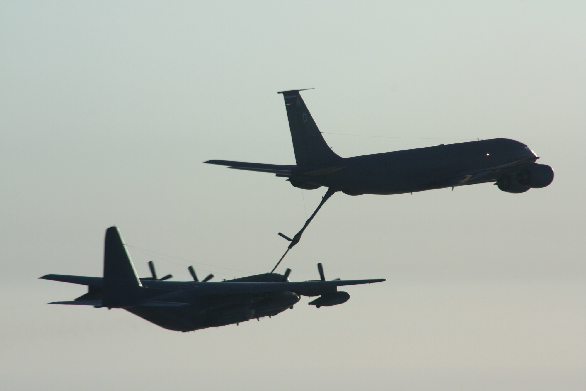 An RAF Mildenhall KC-135 Stratotanker refuels a 352nd Special Operations Group MC-130P Combat Shadow over the skies of the Atlantic Ocean. The 352nd Special Operations Group provided refueling support to six CV-22 Osprey tiltrotor aircraft on their way back to Hurlburt Field, Fla., following their first combat tour.  (U.S. Air Force photo/Capt. John Sisler)