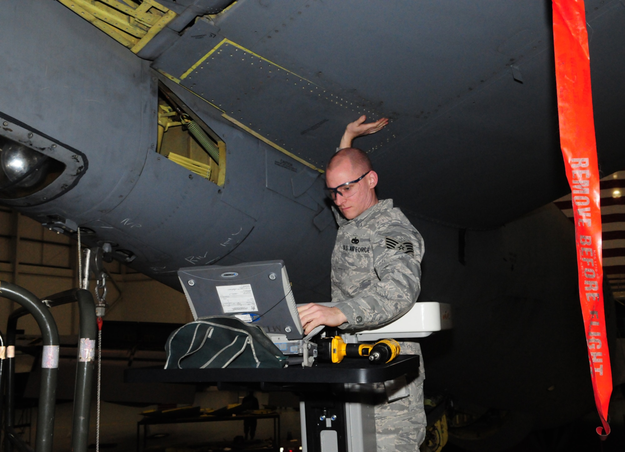 Staff Sgt. Christopher Klaus, 100th Maintenance Squadron ISO dock controller, installs a coffin panel on the bottom of the horizontal stabilixer near the boom area of a KC-135 Stratotanker Dec. 9, 2009. Sergeant Klaus was a major player in the team who put together the AFSO 21 intiative to get mobile maintenance platforms; he masterminded the research and purchase of the platforms. So far, using these stands has saved RAF Mildenhall hundreds of man-hours and many thousands of dollars. (U.S. Air Force photo by Karen Abeyasekere)