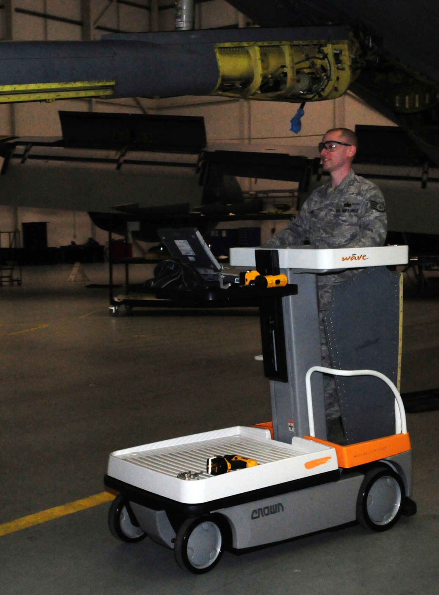 Staff Sgt. Christopher Klaus, 100th Maintenance Squadron ISO dock controller, moves around Hangar 814 on a new mobile maintenance stands, purchased as part of an AFSO 21 initiative. The stands can raise from the ground to a height of almost 3 meters, and can be used on all sections of the aircraft. Using them means the maintainers can be in place with their tools and ready to work within five minutes; using the old stands took an average of 20 minutes, and four people, per aircraft wing, to set up. (U.S. Air Force photo/Karen Abeyasekere)  