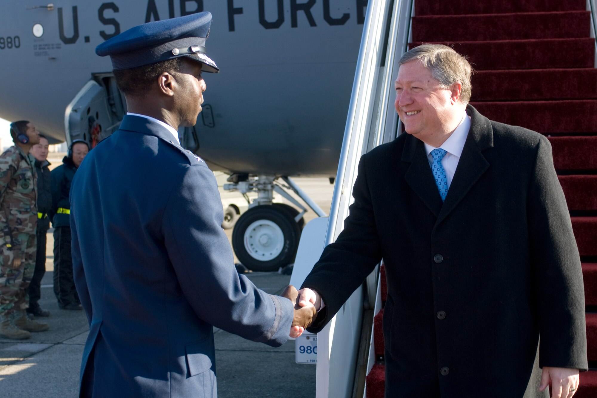 YOKOTA AIR BASE, Japan -- Lt. Gen. Edward Rice, U.S. Forces Japan and 5th Air Force commander, greets Secretary of the Air Force Michael Donley upon his arrival here Dec. 23. Mr. Donley visited here for the first time since he was sworn in as the 22nd secretary of the Air Force on Oct. 17, 2008. (U.S. Air Force photo/Osakabe Yasuo)