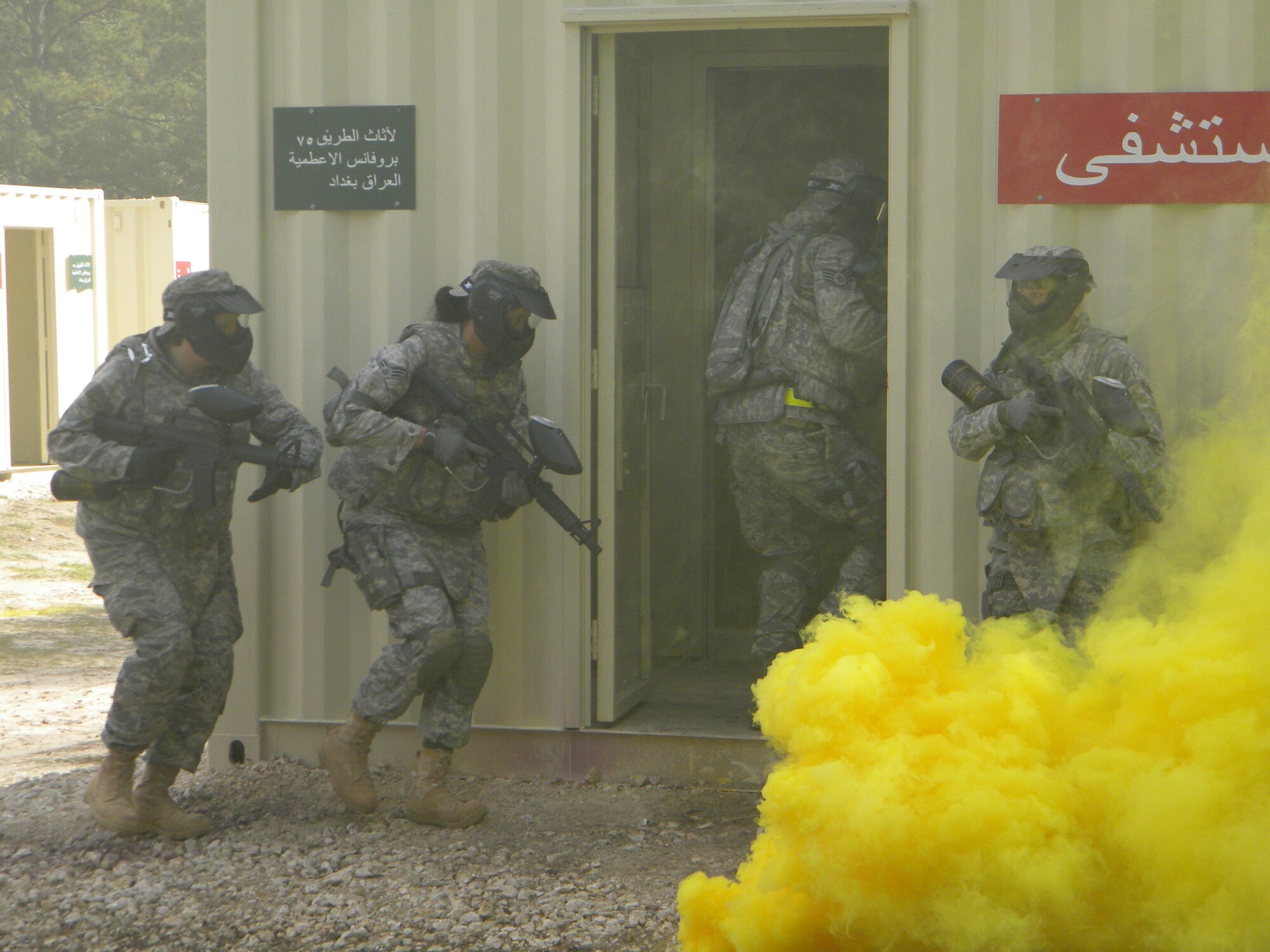 Airmen undergo urban warfare training in December, 2009 at Fort Polk, Louisiana, in preparation for deployments to Afghanistan and Iraq. Many members of the 18th Logistics Readiness Squadron attend the Embedded Training Team Combat Skills Training course here before heading downrange. Seventy seven 18th LRS Airmen will be deployed during the holidays this year. (Courtesy photo)