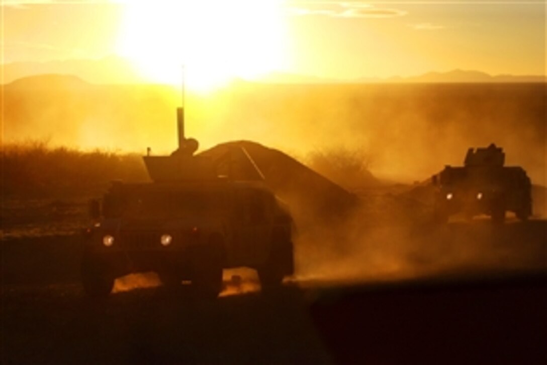U.S. soldiers head home after using every available ray of daylight to train on Fort Bliss, Ruidosa, N.M., Dec. 22, 2009. The soldiers are assigned to the B Detachment, 4th Financial Management Company, 142nd Combat Sustainment Support Battalion.
