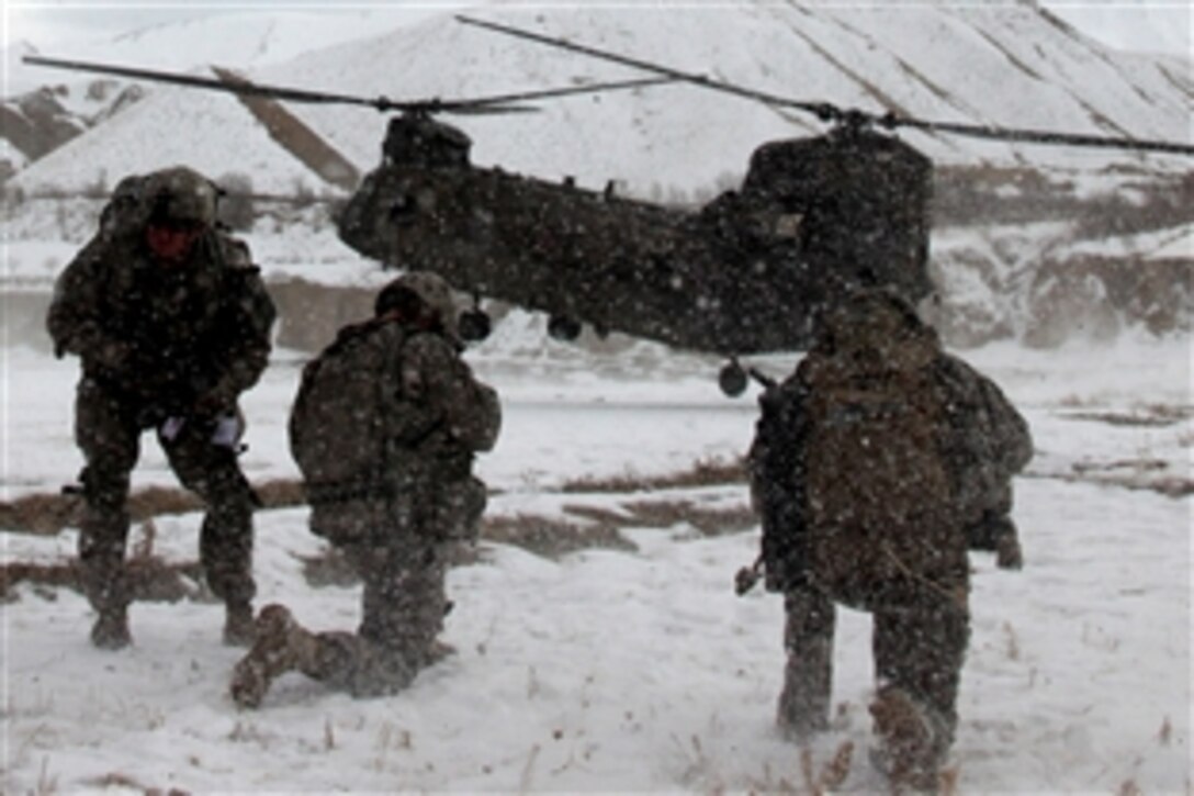 U.S. soldiers provide security before loading a CH-47 Chinook during an air assault mission Dec. 18, 2009, Parwan, Afghanistan. The soldiers are assigned to the 82nd Division's Company B, Special Troops Battalion.