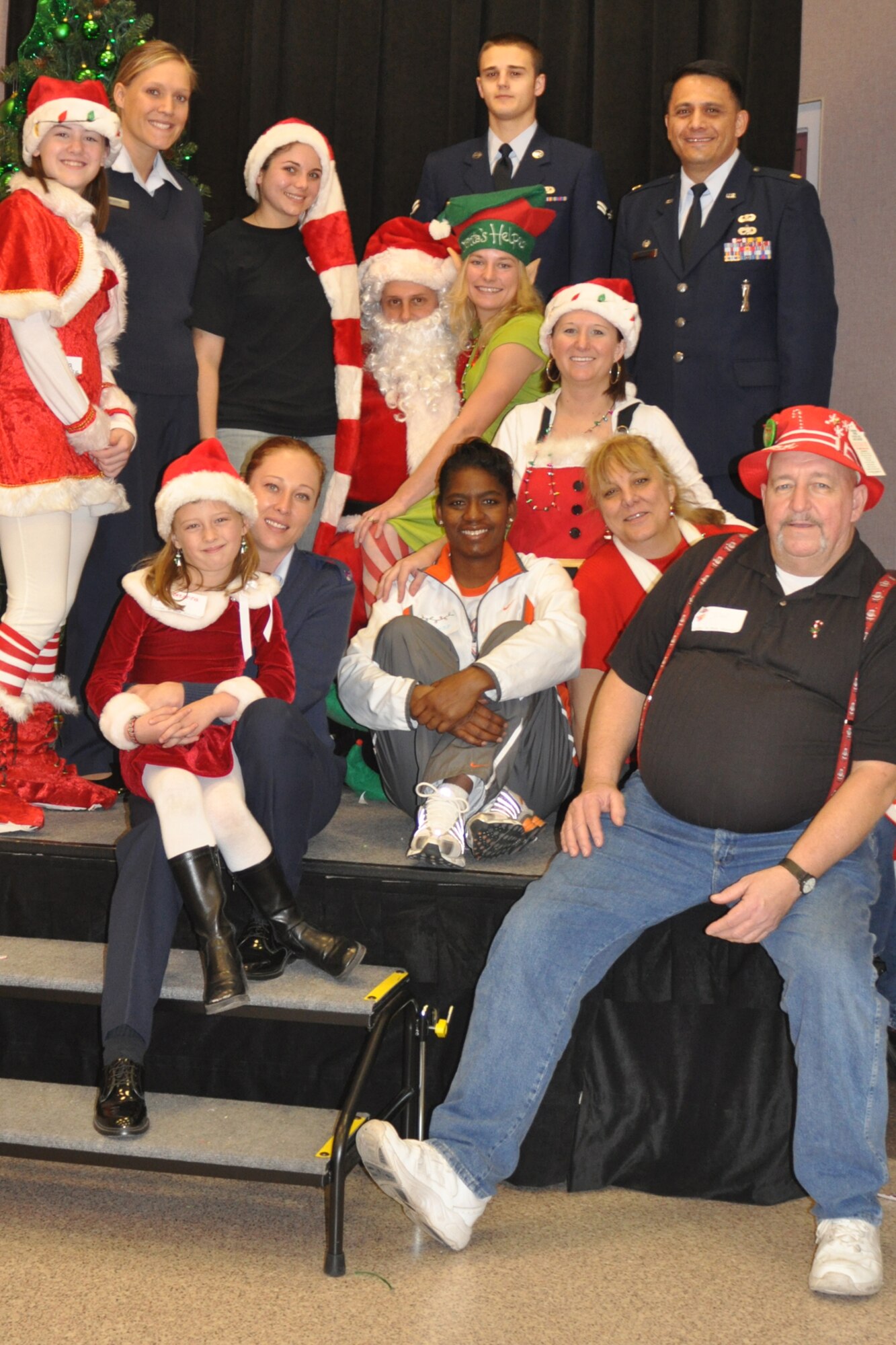 A group of volunteers comprised of personnel and family members from numerous units and organizations, including the 917th Wing, on Barksdale Air Force Base, La., come together for a group photo during the Santas in Blues children’s party at the Bossier City Civic Center December 19, 2009. Santas in Blues is a base-sponsored program which allows Airmen to sponsor underprivileged foster children in the Caddo, Bossier, Webster and De Soto parishes by providing gifts during the holiday season.   (U.S. Air Force Photo/ Senior Airman Crystal Marie Jordan)