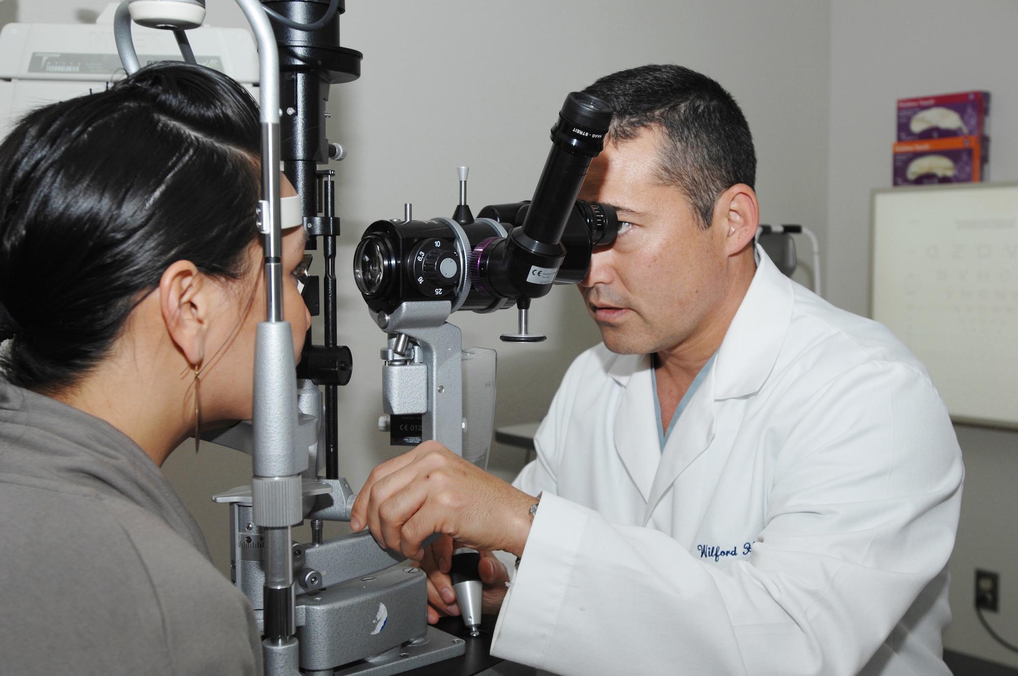 Lt. Col. (Dr.) Charles Reilly examines a patient's eyes Nov. 17, 2009, at Lackland Air Force Base, Texas. Doctor Reilly was the first in the Department of Defense to use a femtosecond laser to cut cornea tissue in preparation for a cornea transplant. Doctor Reilly is the chair of the department of ophthalmology for the 59th Medical Wing. (U.S. Air Force photo/Staff Sgt. Robert Barnett)