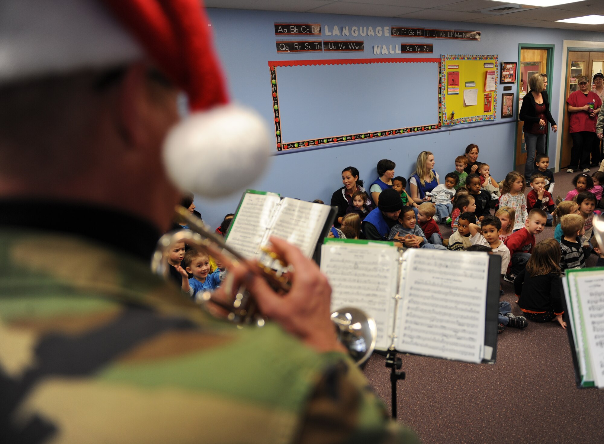 MOUNTAIN HOME AIR FORCE BASE, Idaho -- The Air Force Band of the Golden West brass ensemble plays Christmas carols at the base Child Development Center Dec. 18. The band had a two day visit and played at various locations on base spreading the Christmas joy to all. (U.S. Air Force photo by Airman 1st Class Renishia Richardson)