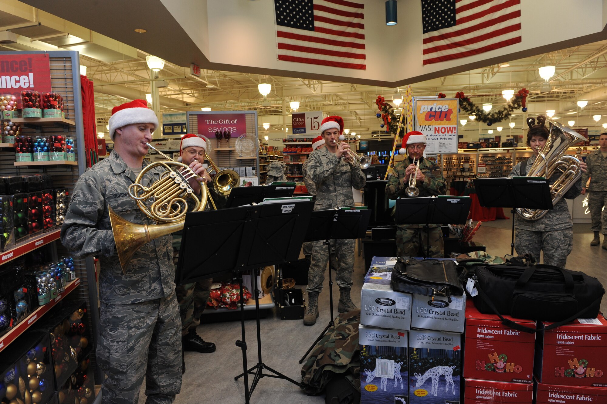MOUNTAIN HOME AIR FORCE BASE, Idaho -- The Air Force Band of the Golden West brass ensemble plays Christmas carols at the base exchange Dec. 17. The band had a two day visit and played at various locations on base spreading the Christmas joy to all. (U.S. Air Force photo by Airman 1st Class Deborah Lockhart)