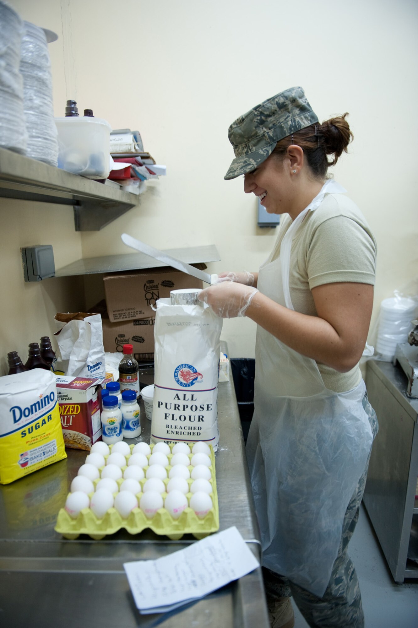 Airman 1st Class Molly Holzem, 379th Expeditionary Force Support Squadron, prepares holiday cookies for servicemembers, Dec. 23, 2009, in Southwest Asia. Airmen Holzem is used a family recipe to help those deployed during the holiday season feel more at home. (U.S. Air Force photo/Staff Sgt. Robert Barney)