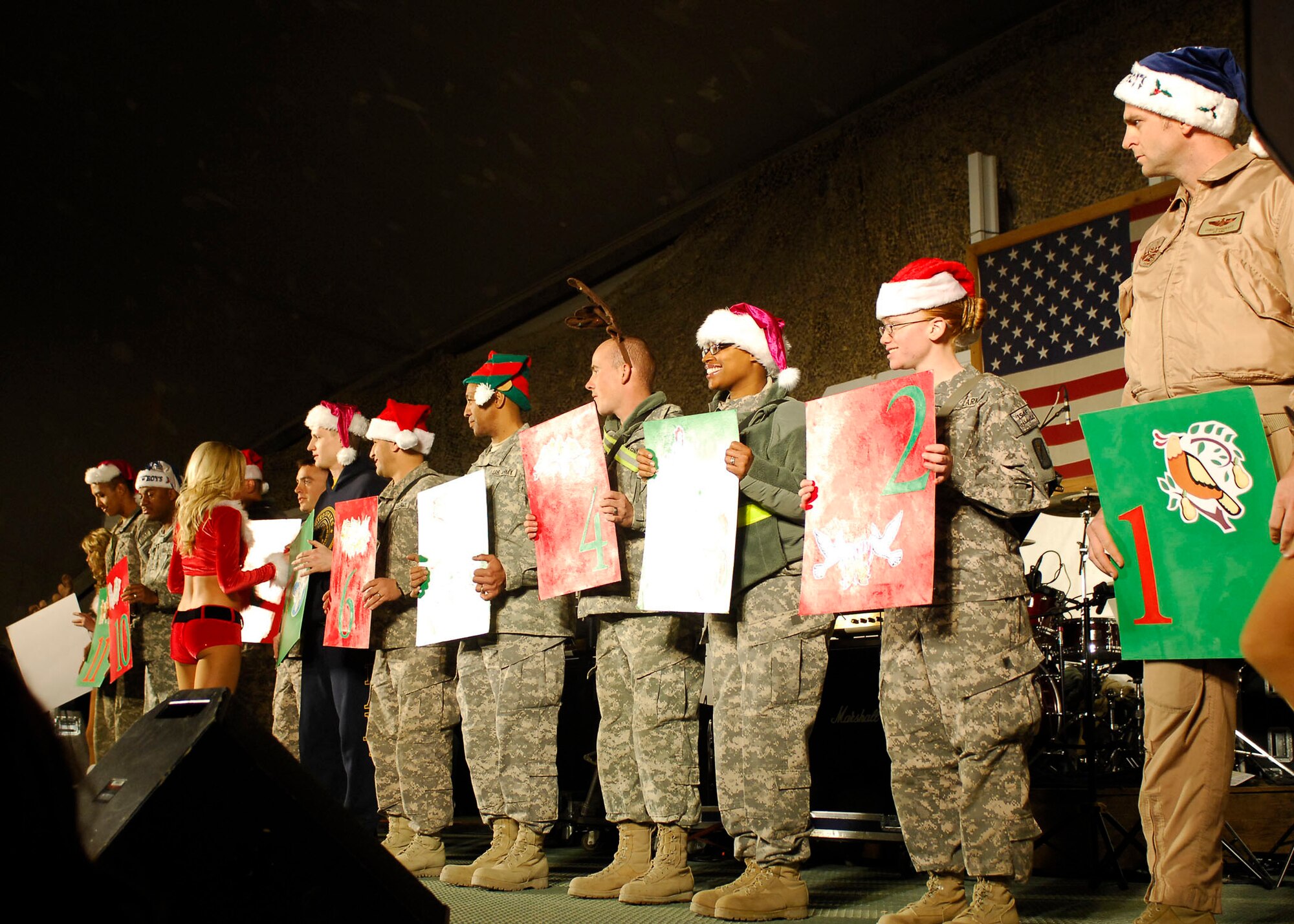 BAGRAM AIRFIELD, Afghanistan -- Airmen, Soldiers, Sailors and Marines came out to see the Dallas Cowboy Cheerleaders during a United Service Organizations tour Dec. 23, 2009.  The cheerleaders and other celebrities supported the troops during this USO tour.  (U.S. Air Force photo/Senior Airman Felicia Juenke)