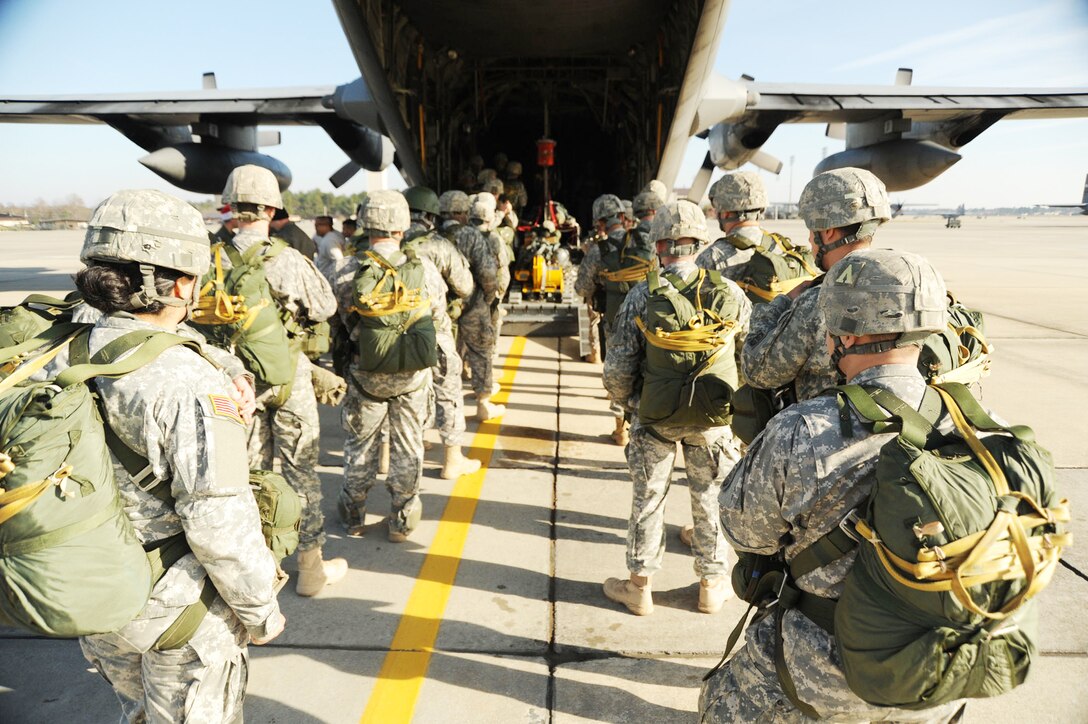 Soldiers load onto a C-130 Hercules Dec. 6, 2009, at Pope Air Force Base, N.C. More than 1,000 paratroopers donated a toy to get the opportunity to jump into Fort Bragg's Sicily Drop Zone. Other crews from the National Guard's 145th Airlift Wing from Charlotte, N.C., and the Air Force Reserve's 910th Airlift Wing from Youngstown, Ohio, participated in the 12th Annual Randy Oler Operation Toy Drop. U.S. Air Force photo by Senior Airman Peter Miller