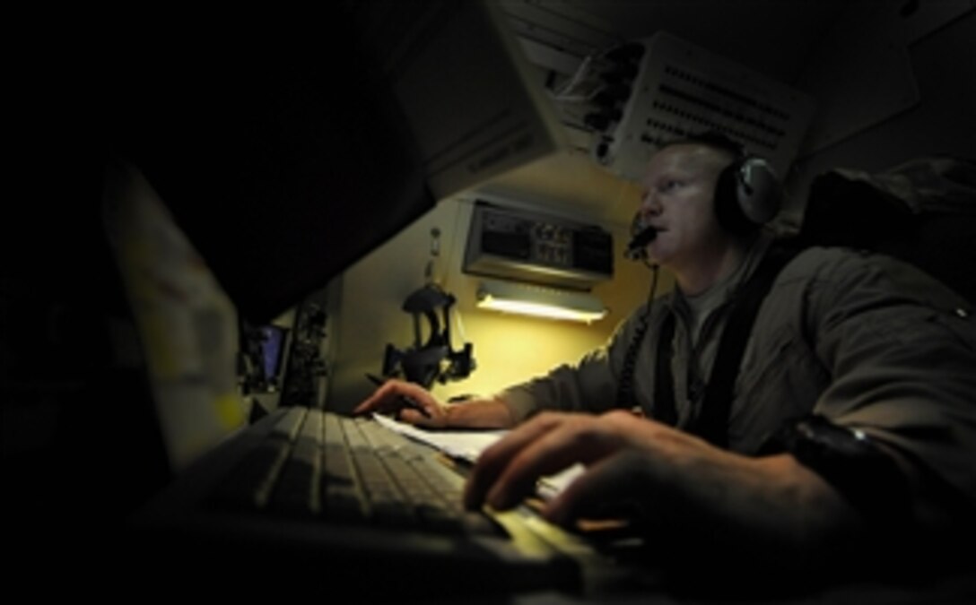 U.S. Air Force Capt. Ronald Alligood, a 7th Expeditionary Air Command and Control Squadron joint surveillance target attack radar system (JSTARS) navigator stationed at Robins Air Force Base, Ga., sets up an orbit course for JSTARS to fly at a location in southwest Asia on Dec. 18, 2009.  Setting up an orbit course maximizes the radar coverage JSTARS will receive during this mission.  JSTARS is a command and control platform that conducts ground surveillance to support attack operations and contributes to the disruption of enemy forces.  