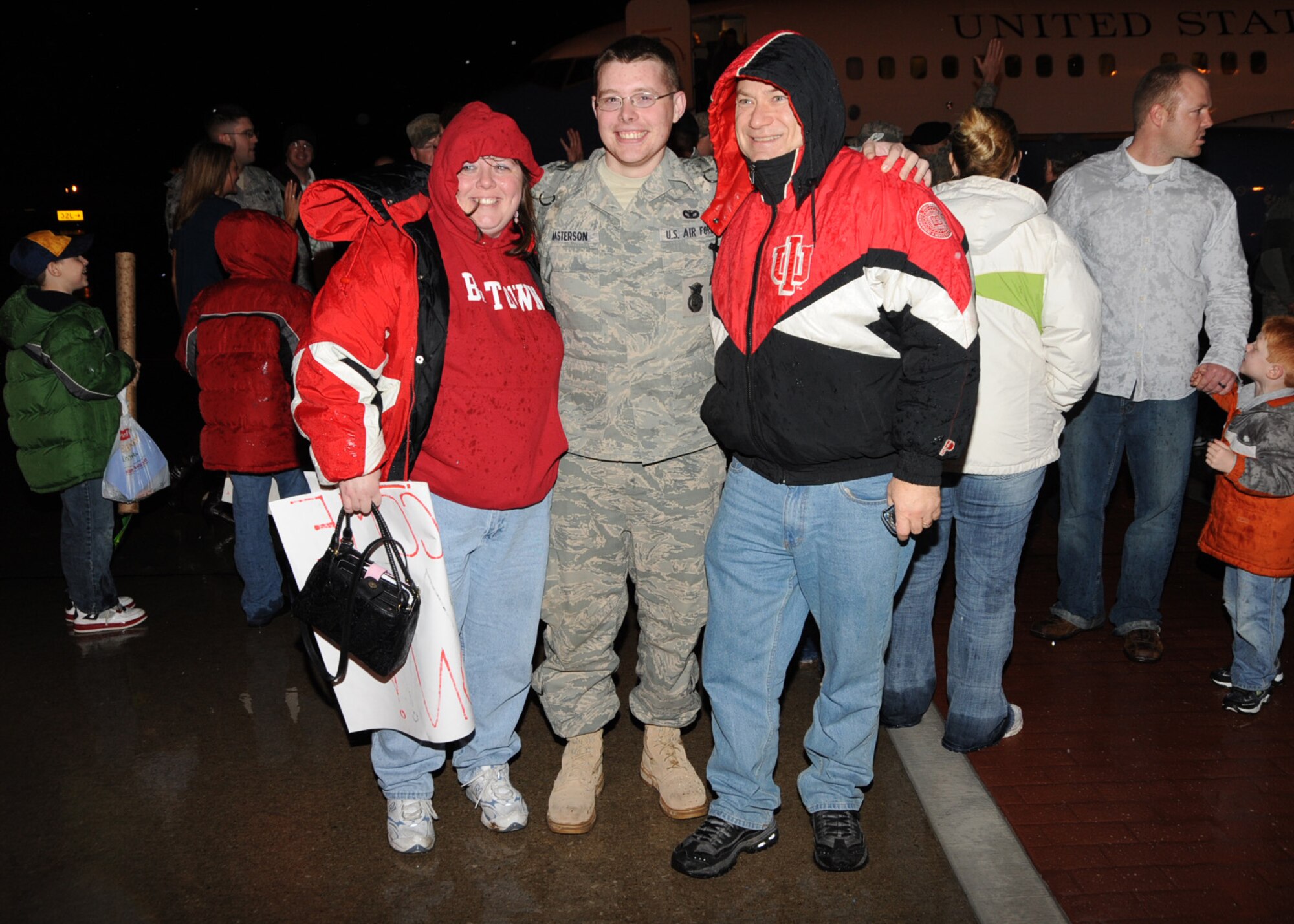 After a long and delay-filled journey from Iraq, Airman 1st Class Andrew Masterson, 375th Security Forces Squadron, touches down at Scott Air Force Base, met by friends and family as he and 34 other Airmen arrived about 9:30 p.m. Christmas Eve. They Arrived just in time for Christmas thanks to a joint effort by the 375th Air Mobility Wing and the 932nd Airlift Wing (Reserve) who were flown from Baltimore to Scott Air Force Base via a C-40 aircraft with both Reserve and Active-duty crewmembers volunteering to bring them home in time for the holidays.(U.S. Air Force photo/Airman 1st Class Tristin English)