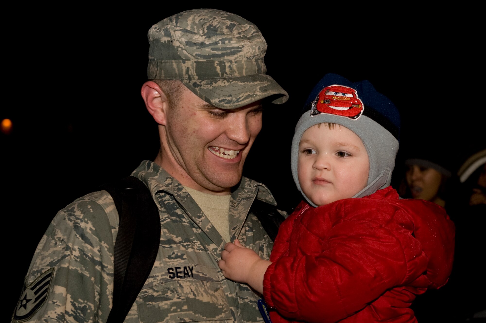 Arriving just in time for Christmas thanks to a joint effort by the 375th Air Mobility Wing and the 932nd Airlift Wing (Reserve) at Scott were 34 members of the 375th Security Forces Squadron returning from their deployment in Iraq.  Among the returning team is Staff Sgt. Marcus Seay greeting his son, Porter, as he arrived about 9:30 p.m. Christmas Eve.  He and the other Airmen were flown from Baltimore to Scott Air Force Base via a C-40 aircraft with both Reserve and Active-duty crewmembers volunteering to bring them home in time for the holidays.(U.S. Air Force photo/Airman 1st Class Wesley Farnsworth)

