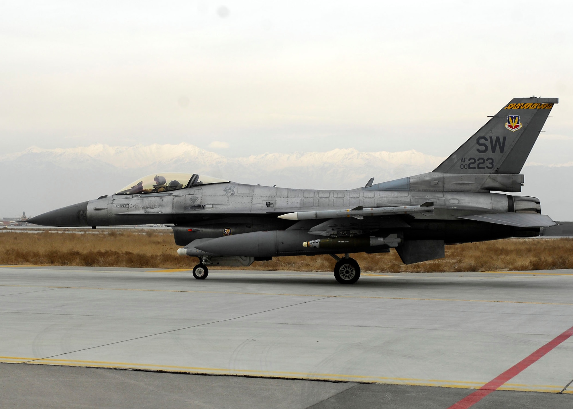 BAGRAM AIRFIELD, Afghanistan -- An F-16 Fighting Falcon from the 79th Expeditionary Fighter Squadron prepares to take off from the flightline Dec. 26, 2009. The F-16 provides a relatively low-cost, high-performance weapon system for the United States and allied nations.  (U.S. Air Force photo/Senior Airman Felicia Juenke)