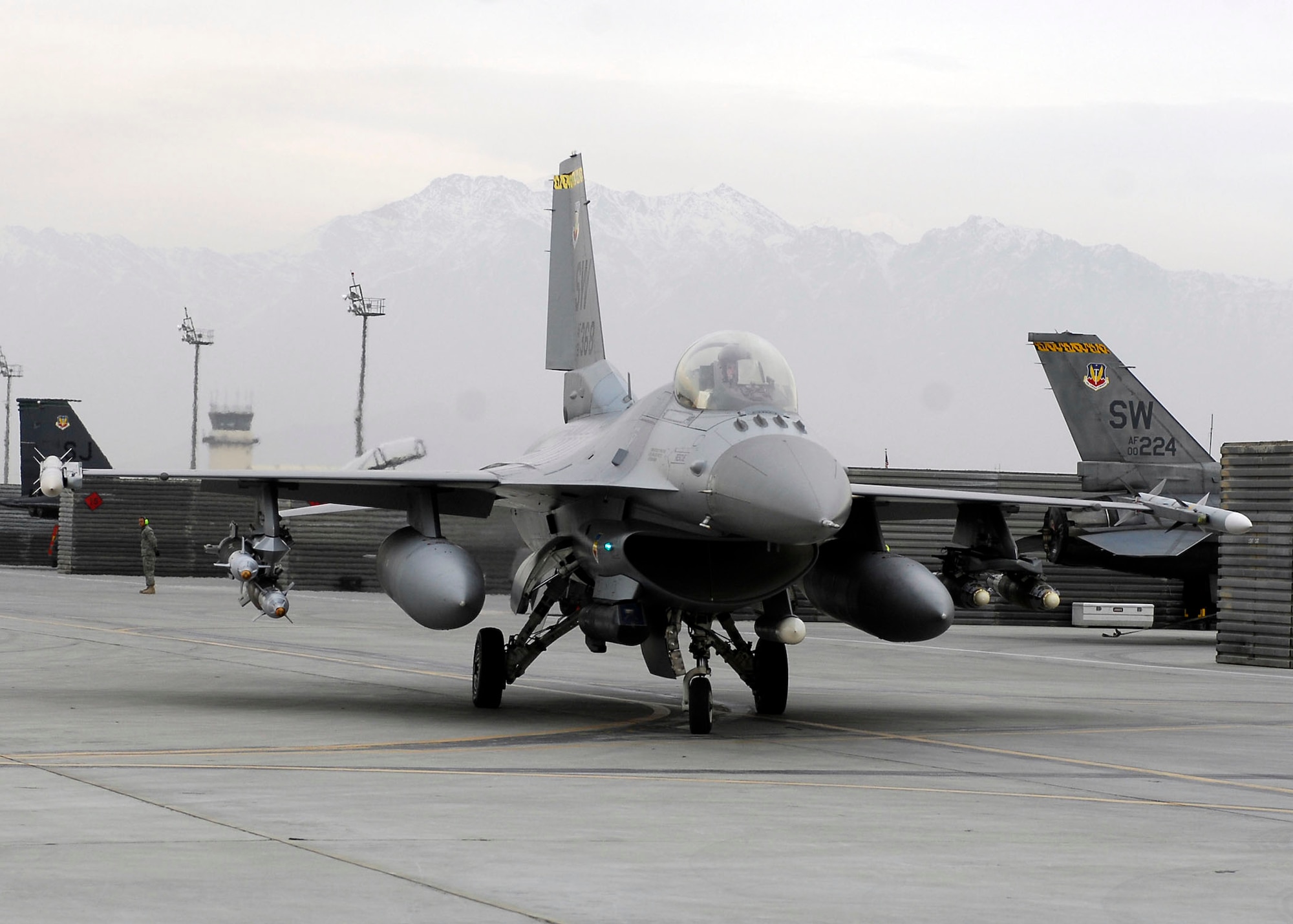 BAGRAM AIRFIELD, Afghanistan -- An F-16 Fighting Falcon from the 79th Expeditionary Fighter Squadron prepares to take off from the flightline Dec. 26, 2009. The F-16 provides a relatively low-cost, high-performance weapon system for the United States and allied nations.  (U.S. Air Force photo/Senior Airman Felicia Juenke)