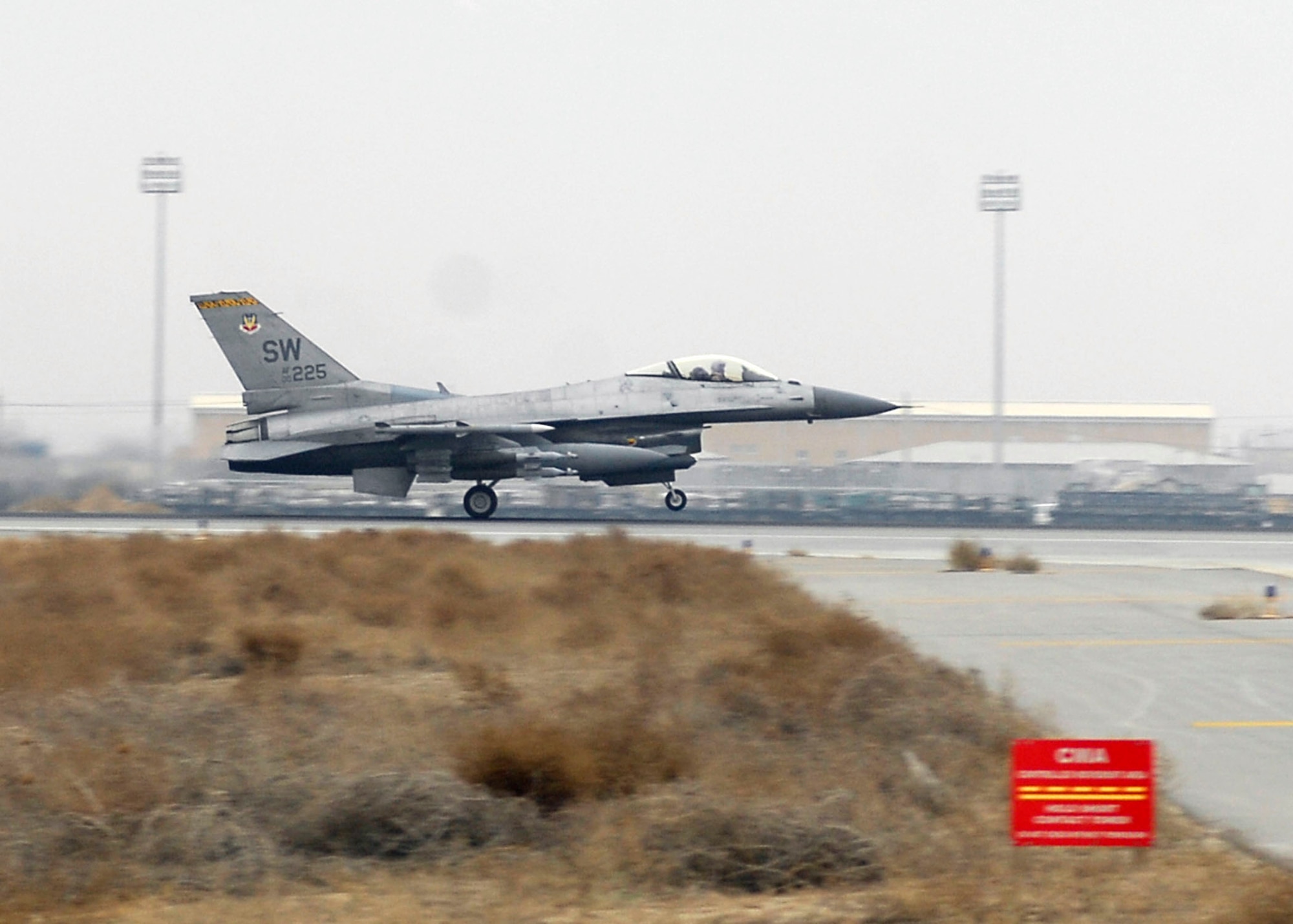 BAGRAM AIRFIELD, Afghanistan -- A 79th Expeditionary Fighter Squadron F-16 Fighting Falcon from Shaw Air Force Base, S.C. takes off from the flightline Dec. 26, 2009. The F-16 provides a relatively low-cost, high-performance weapon system for the United States and allied nations.  (U.S. Air Force photo/Senior Airman Felicia Juenke)