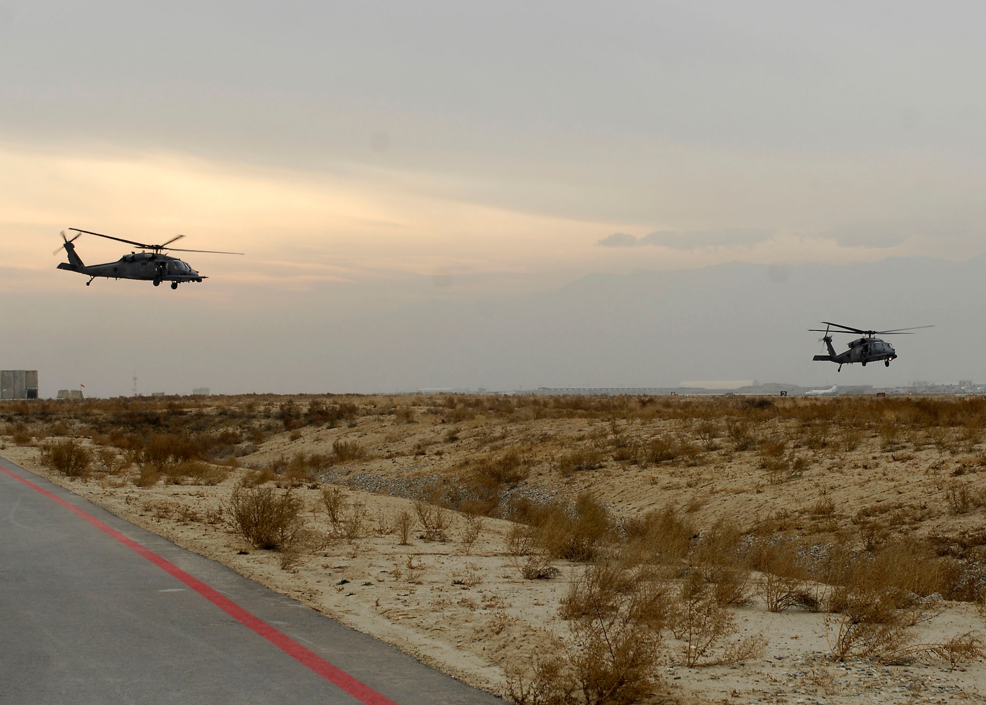 BAGRAM AIRFIELD, Afghanistan -- Two HH-60G Pave Hawks receive permission to depart for their mission Dec. 26, 2009.  The Pave Hawks primary mission is to conduct day or night personnel recovery operations in hostile environments.  (U.S. Air Force photo/Senior Airman Felicia Juenke)