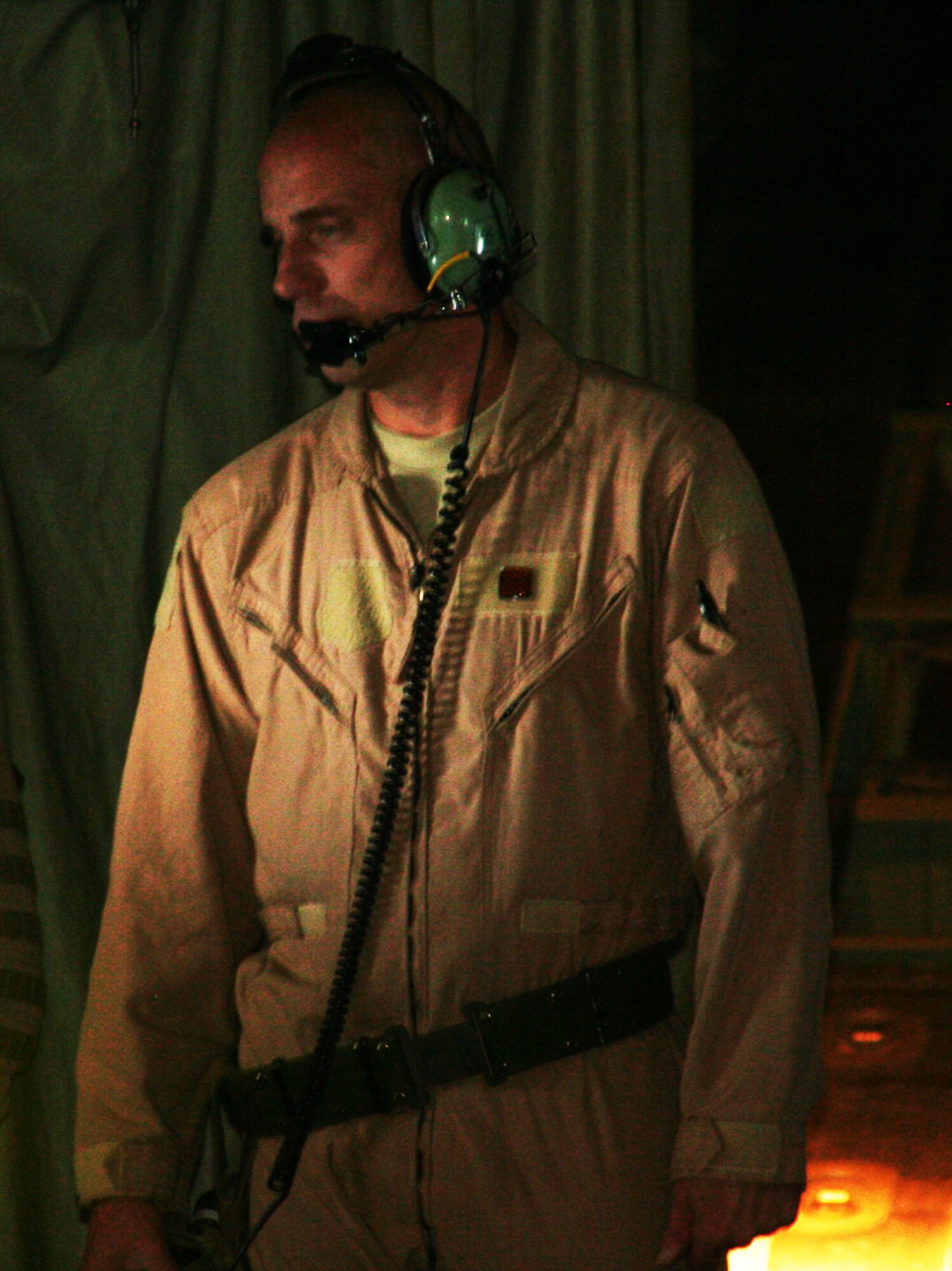 Master Sgt. John Kttrell, C-130J Hercules loadmaster, looks out the window of a KC-10 during an airlift mission over Afghanistan, on Dec. 25, 2009. The C-130 was on an airlift mission for Operation Enduring Freedom. (U.S. Air Force Photo/Tech. Sgt. Scott T. Sturkol)