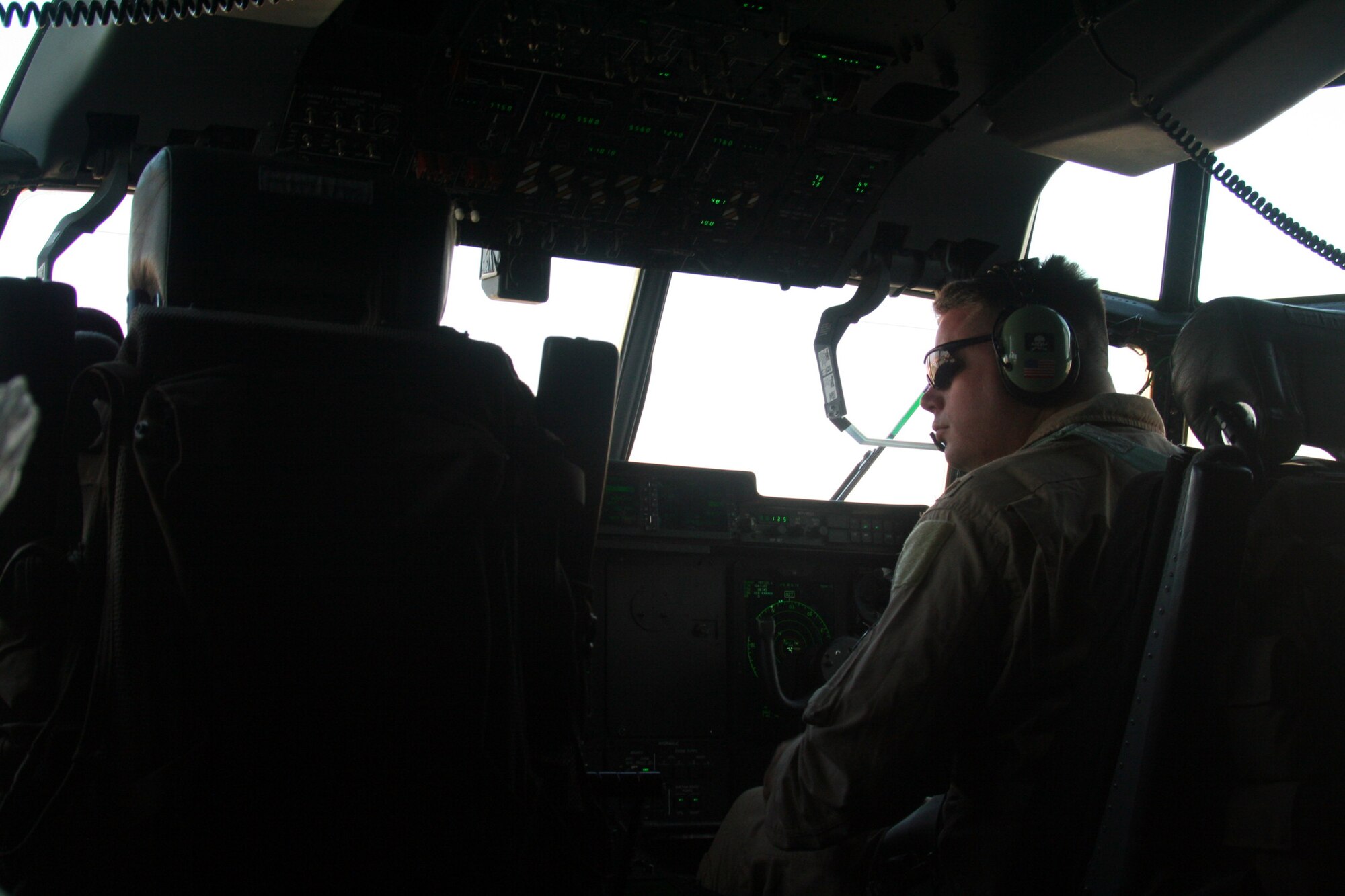 Aircrew members prepare a C-130J Hercules for an Operation Enduring Freedom mission from Bagram Air Field, Afghanistan, on Dec. 25, 2009. (U.S. Air Force Photo/Tech. Sgt. Scott T. Sturkol)