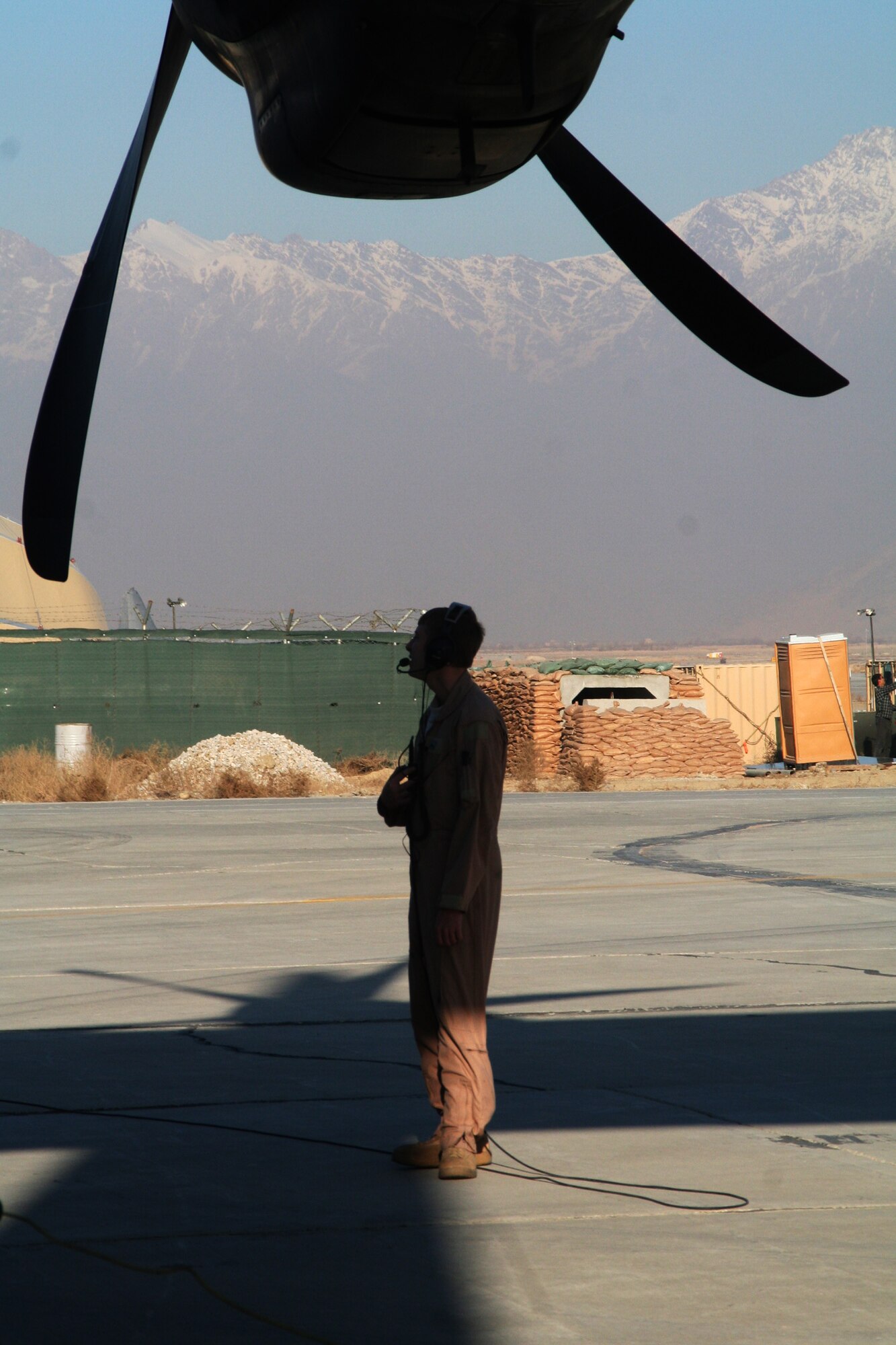 Tech. Sgt. Joe Helm, C-130J Hercules loadmaster, prepares a C-130 for an Operation Enduring Freedom mission on Dec. 25, 2009. Sergeant Helm is deployed from the 815th Airlift Squadron at Keesler Air Force Base, Miss. (U.S. Air Force Photo/Tech. Sgt. Scott T. Sturkol)