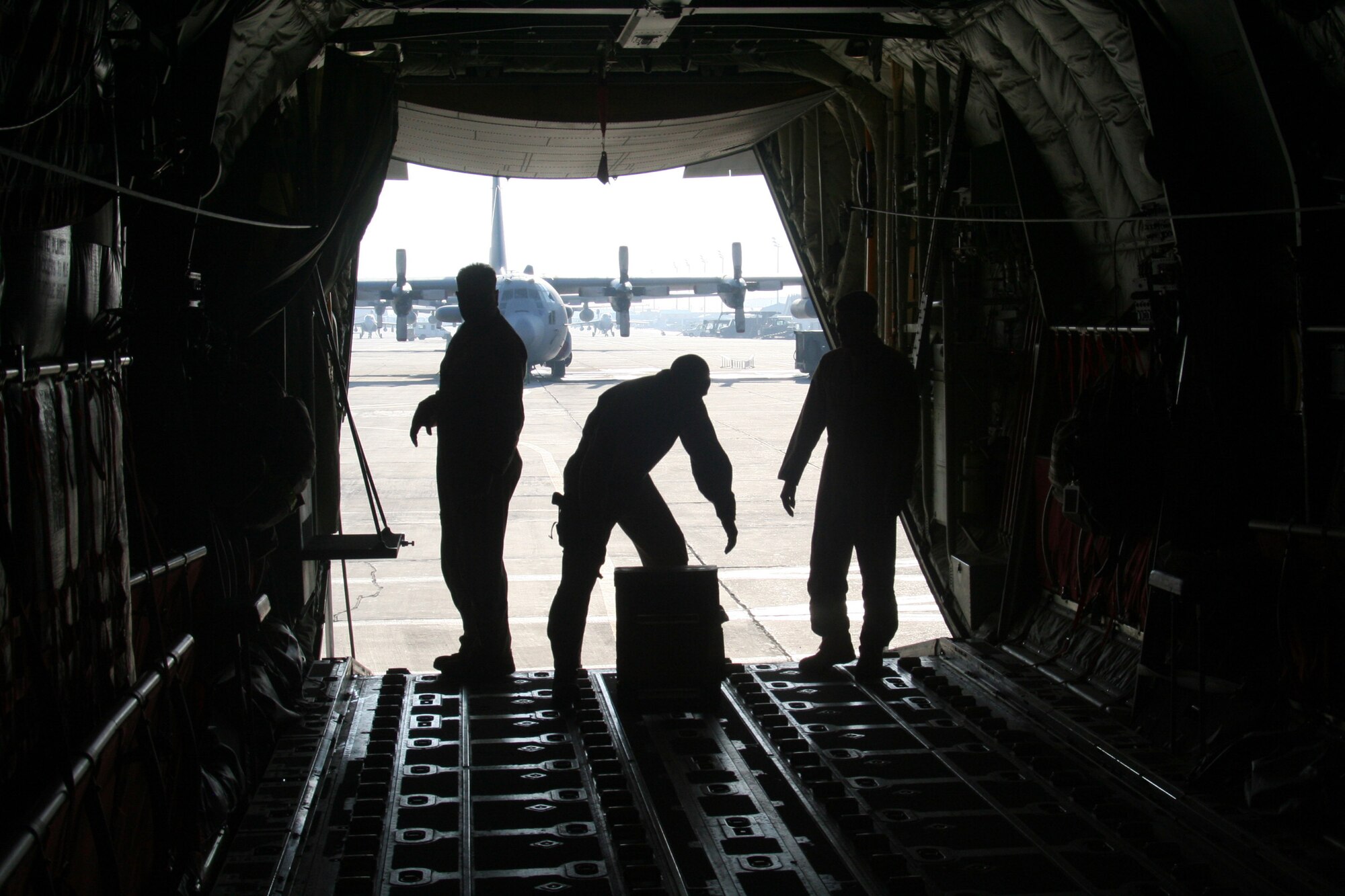 C-130J Hercules airecrew members prepare a C-130J for a mission during airlift operations at Bagram Air Field, Afghanistan, on Dec. 25, 2009. The C-130's mission was for Operation Enduring Freedom. (U.S. Air Force Photo/Tech. Sgt. Scott T. Sturkol)