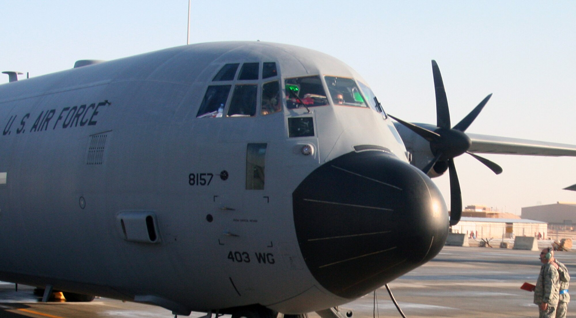 Airmen prepare a C-130J Hercules for a mission for Operation Enduring Freedom at an undisclosed base in Southwest Asia on Dec. 25, 2009. The C-130 is one of the lead airlift aircraft the Air Force and Air Mobility Command uses to "fly, fight and win...in air, space and cyberspace." (U.S. Air Force Photo/Tech. Sgt. Scott T. Sturkol)