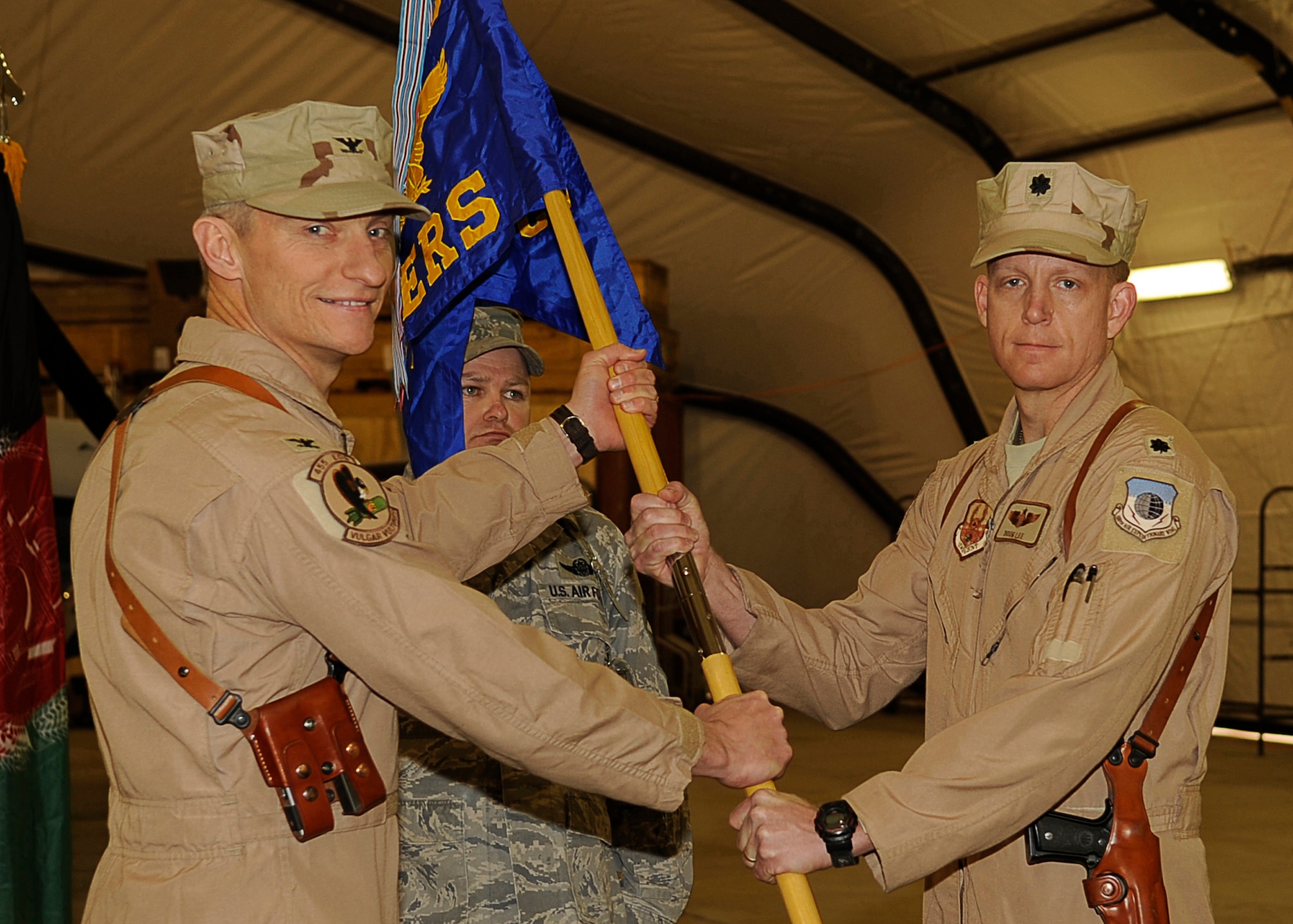 BAGRAM AIRFIELD, Afghanistan --  Col. Patrick McKenzie, 455th Air Expeditionary Wing Operations Group Commander, presents the unit guidon to Lt. Col. Douglas Lee at the activation of the 4th Expeditionary Reconnaissance Squadron Dec. 27, 2009. (U.S. Air Force photo/Tech. Sgt. Jeromy K. Cross)