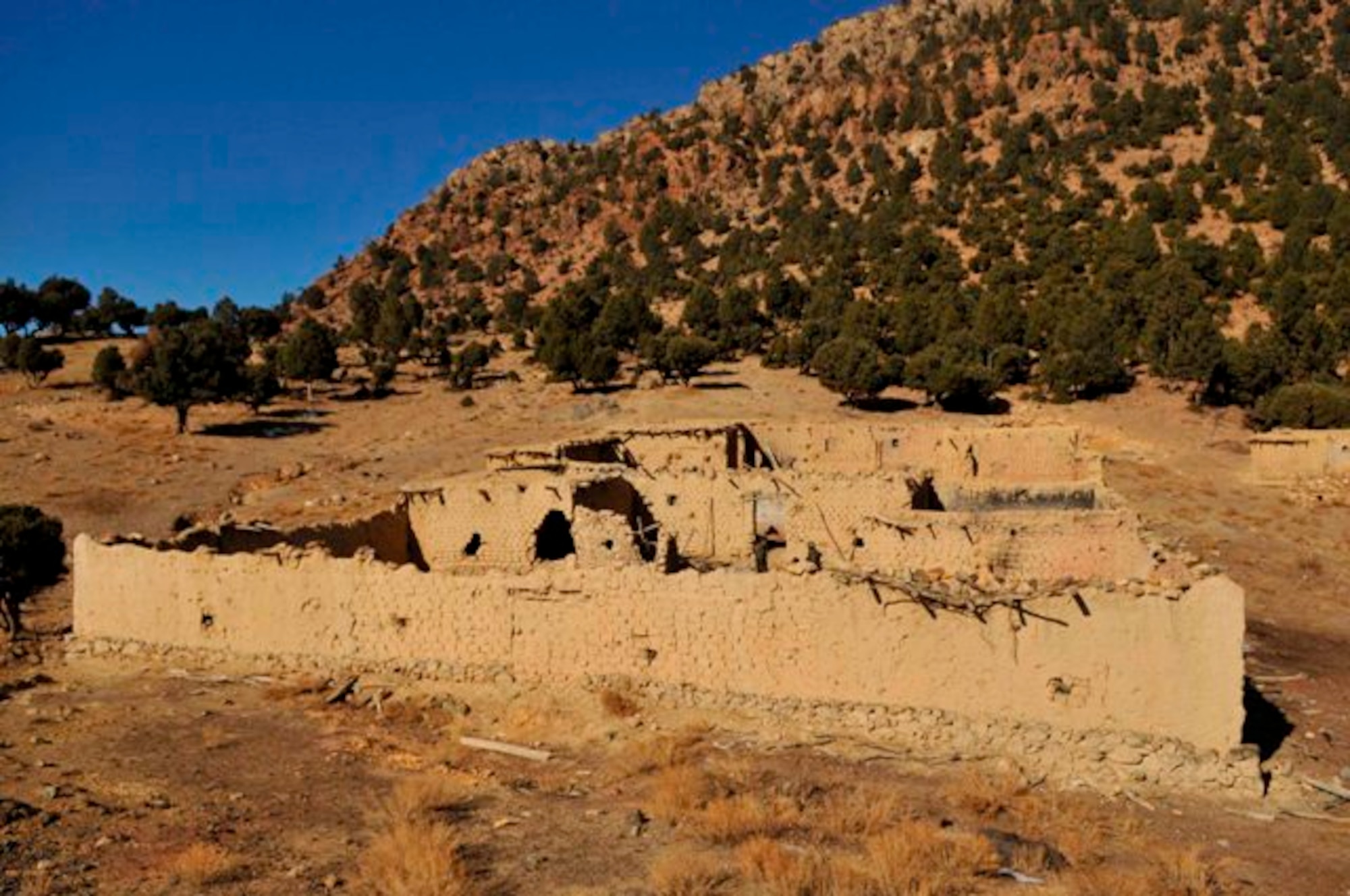 KHOST PROVINCE, Afghanistan - An view of the “Taliban Hotel,” a safehouse utilized by insurgent fighters infiltrating, Dec. 18. An Explosive Ordnance Disposal team from the 707th EOD unit, Fort Lewis, Wash., partnered with soldiers from the 1st Squadron, 40th Cavalry Regiment, 4th Brigade Combat Team, 25th Infantry Division, out of Fort Richardson, Alaska, and Afghan National Security Forces to explosively level the safehouse. (U.S. Air Force photo/Staff Sgt. Stephen J. Otero)