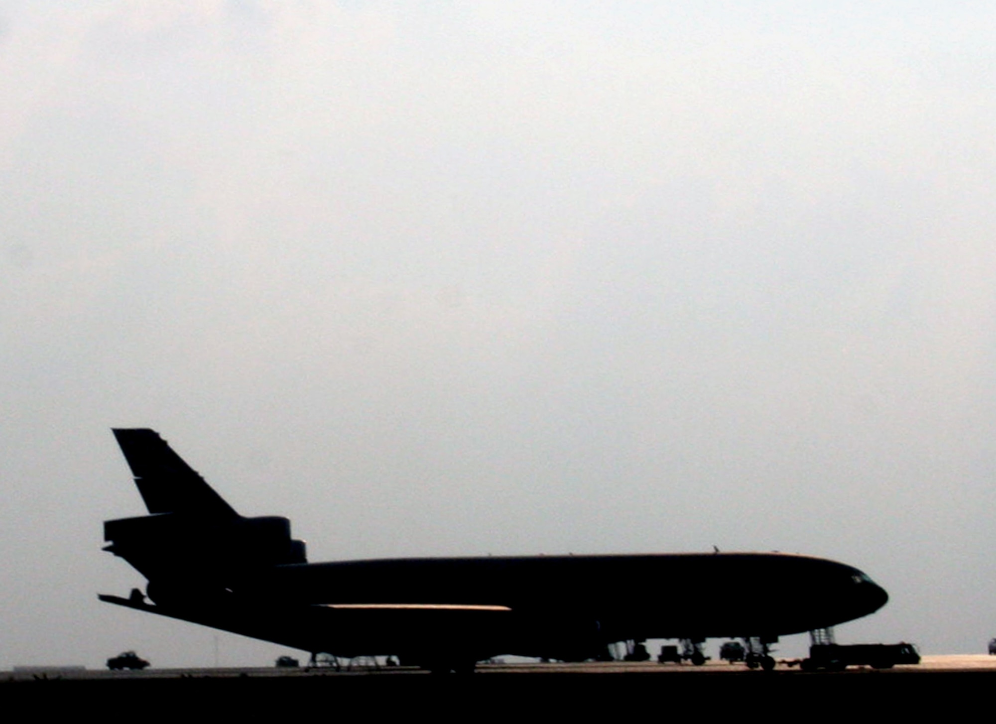 A KC-10 Extender is parked on the flightline in a non-disclosed location on Southwest Asia on Dec. 27, 2009. KC-10 Extenders are one of the airframes deployed to the 380th Air Expeditionary Wing providing air refueling support for Operations Enduring Freedom and Iraqi Freedom and Joint Task Force-Horn of Africa.  The KC-10 is an Air Mobility Command advanced tanker and cargo aircraft that can move up to 170,000 pounds of cargo or carry more than 356,000 pounds of fuel.  (U.S. Air Force Photo/Tech. Sgt. Scott T. Sturkol)