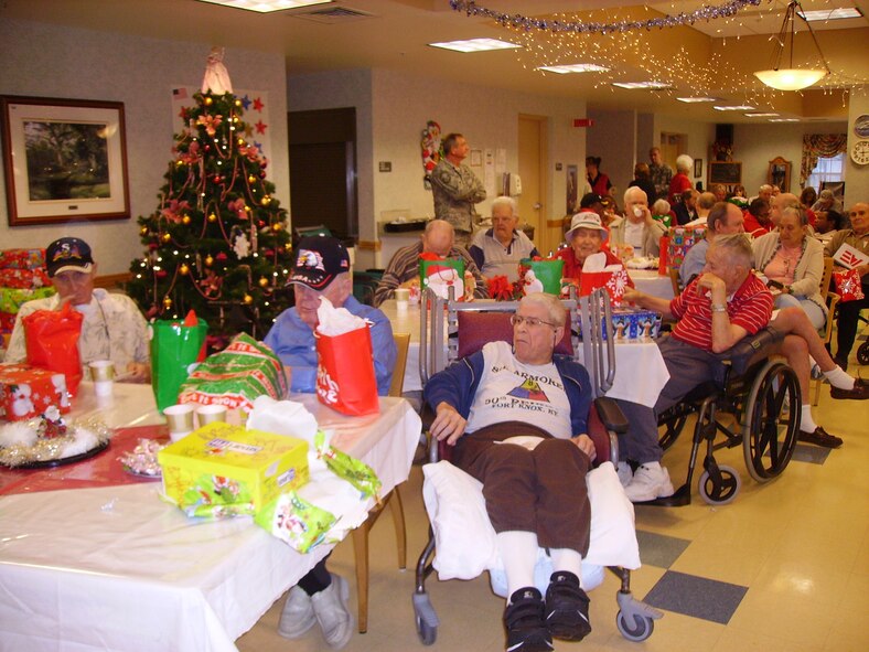 Resident veterans enjoy the Christmas Eve Holiday party at the Baldomero Lopez State Veterans' Nursing Home. (U.S. Air Force photo/Tech. Sgt. Denise Hauser) 