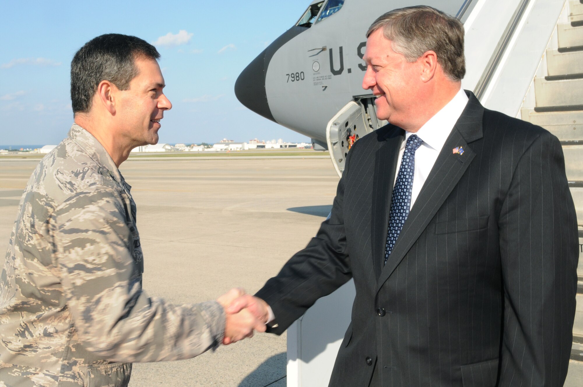 Brig. Gen. Ken Wilsbach, 18th Wing commander, greets Mr. Michael Donley, Secretary of the Air Force, at Kadena Air Base, Japan, Dec. 22. Secretary Donley visited Kadena as part of a six-base Pacific tour to spend time with Airmen and thank them for serving overseas far from home during the holiday season. 
(U.S. Air Force photo / Airman 1st Class Amanda N. Grabiec)
