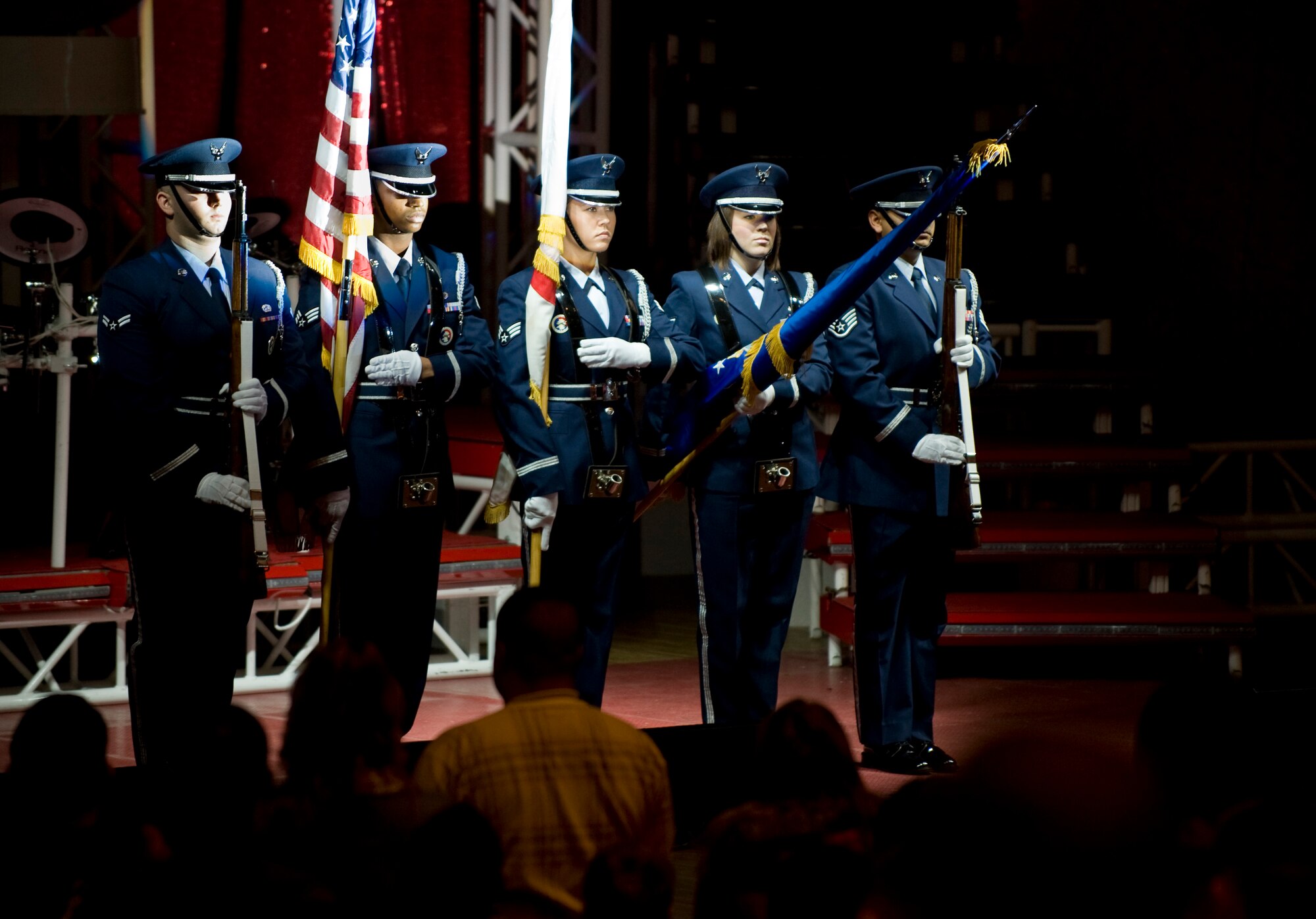 MISAWA CITY, Japan -- Members of the Misawa Air Base honor guard present the colors at the beginning of a Tops in Blue performance at the Misawa Civic Center Dec. 27. The performance opened with the playing of the American and Japanese national anthems as well as opening comments from Misawa City Mayor Kazumasa Taneichi and Col. David Stilwell, 35th Fighter Wing commander. (U.S. Air Force photo/Staff Sgt. Samuel Morse)