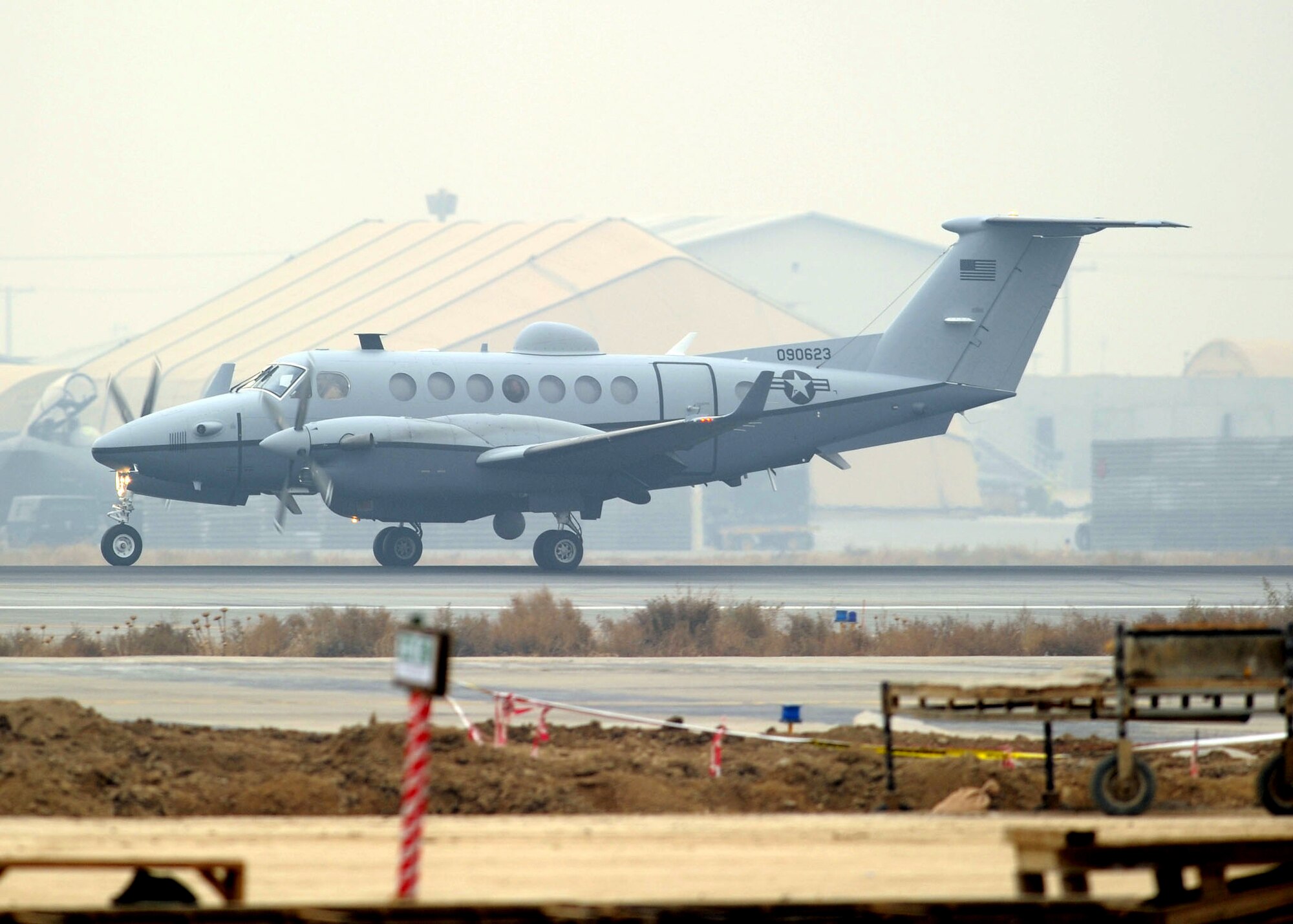 Airmen welcomed the first Air Force MC-12 to be based in Afghanistan Dec. 27, 2009. The aircraft brings another capability to Operation Enduring Freedom, because the MC-12 is not just an aircraft, but a complete collection, processing, analysis and dissemination system of Airmen committed to securing Afghanistan and protecting Afghan and coalition lives. (U.S. Air Force photo/Senior Airman Felicia Juenke)