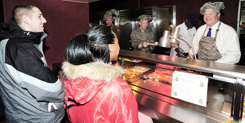 Secretary of the Air Force Michael B. Donley serves Christmas Day dinner at the Gingko Tree Dining Facility at Osan Air Base, South Korea. Secretary Donley met with Airmen assigned to the 51st Fighter Wing, 8th Fighter Wing, 7th Air Force and South Korean airmen during his two-day trip to the peninsula. (U.S. Air Force photo/1st Lt. Chris Hoyler)