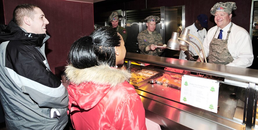 Secretary of the Air Force Michael B. Donley serves Christmas Day dinner at the Gingko Tree Dining Facility at Osan Air Base, South Korea. Secretary Donley met with Airmen assigned to the 51st Fighter Wing, 8th Fighter Wing, 7th Air Force and South Korean airmen during his two-day trip to the peninsula. (U.S. Air Force photo/1st Lt. Chris Hoyler)