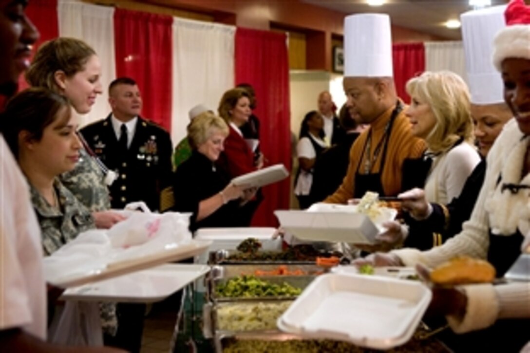 Dr. Jill Biden, wife of Vice President Joe Biden, center right, serves lunch to patients and staff in the dining facility at Walter Reed Army Medical Center on Christmas Day, Dec. 25, 2009. The Bidens served Christmas lunch and met with families and wounded soldiers during their visit.