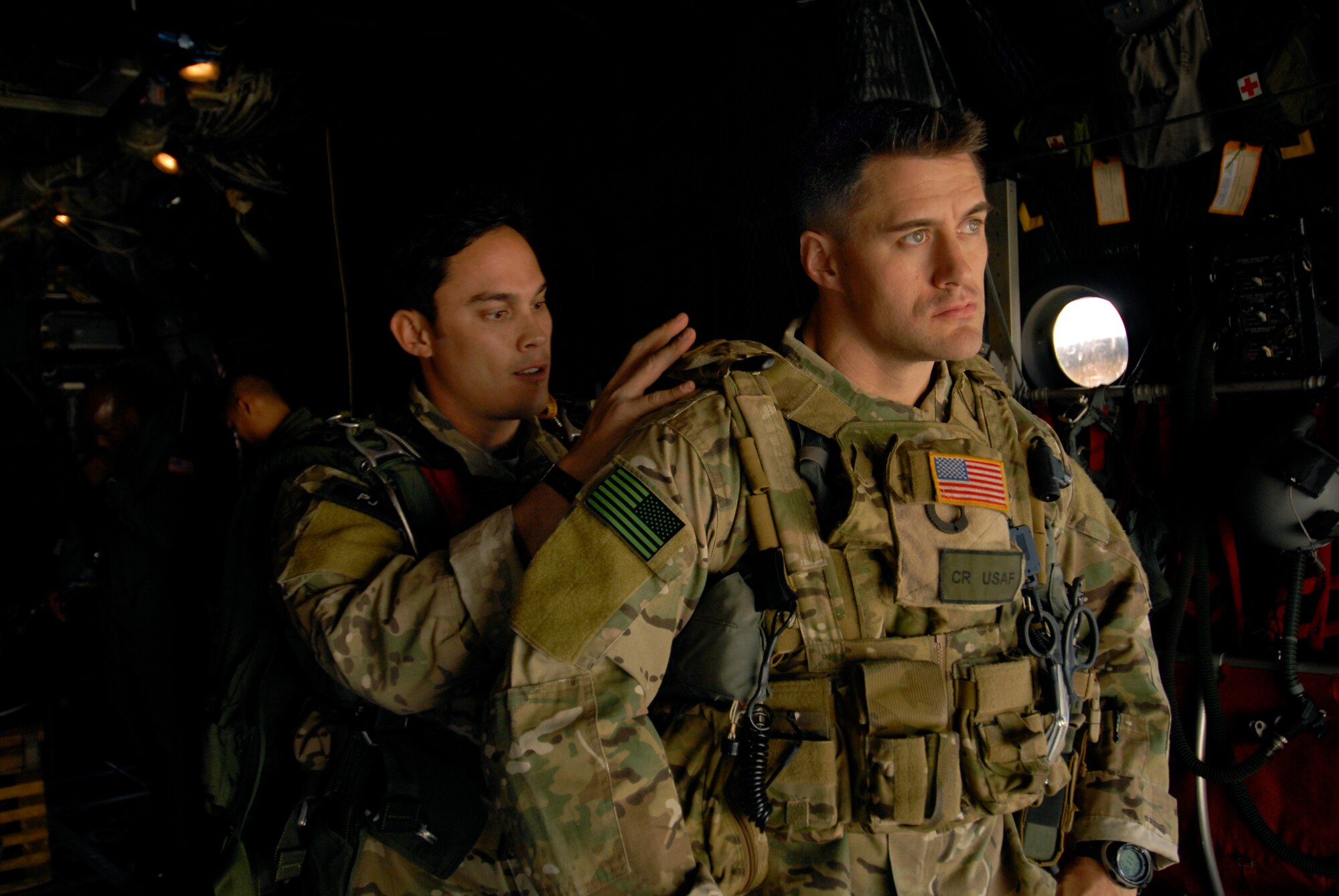 Staff Sgt. Ryan Hatfield checks Master Sgt. Jeremiah Coomer, both from the 320th Special Tactics Squadron, before a high altitude low opening jump over Ie Shima Island, Japan Dec. 23, 2009. The jump was part of routine training for the 320th and the 31st Rescue Squadron. (U.S. Air Force photo / Airman 1st Class Chad Warren) 