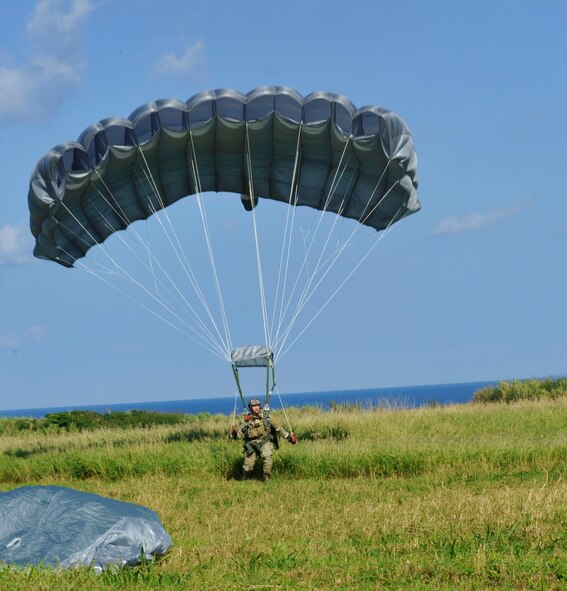 Master Sgt. Jeremiah Coomer, 320th Special Tactics Squadron, lands on Ie Shima Island after a high altitude low opening jump Dec. 23, 2009. The jump was part of routine training for the 320th and the 31st Rescue Squadron. (U.S. Air Force photo / Tech. Sgt. Angelique Perez)