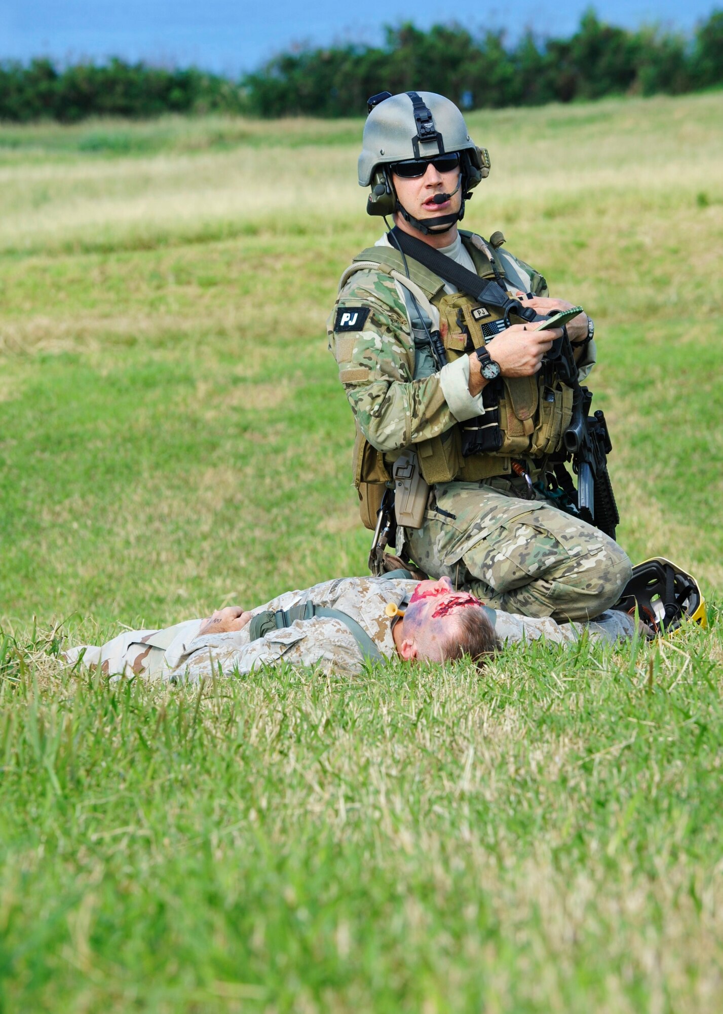 A Pararescueman assigned to Kadena Air Base treats a simulated casualty on Ie Shima Island during a training exercise Dec. 23, 2009. The simulation was part of routine training for the 320th Special Tactics Squadron and the 31st Rescue Squadron.  (U.S. Air Force photo / Tech. Sgt. Angelique Perez)
