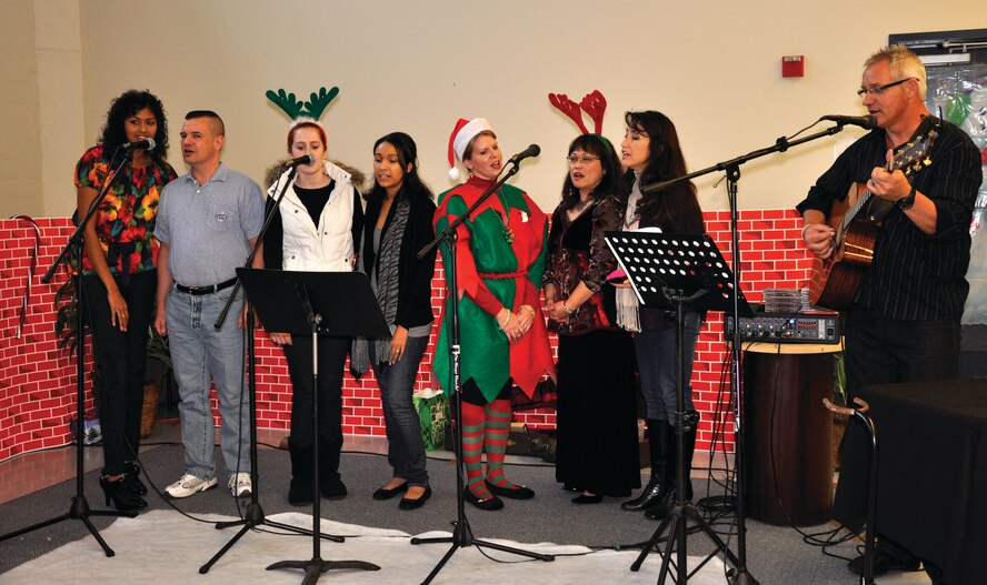 Holiday caroling.  (U.S. Air Force photos by Tech. Sgt. Teresa Bertani)
