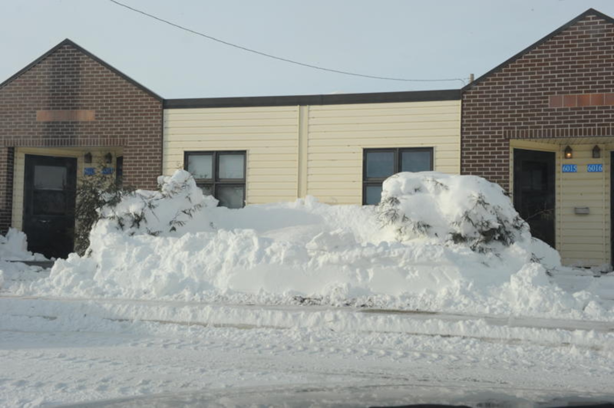 MINOT AIR FORCE BASE, N.D. -- Snow piled up in front of Temporary lodging after Minot residents recover from blizzard here, Dec. 29. A christmas weekend blizzard resulted in 25.7 inches of snow. In addition to this, the drifts made driving difficult on surrounding highways and in the surrounding communities. (U.S. Air Force Photo by Staff Sgt. Stacy Moless)