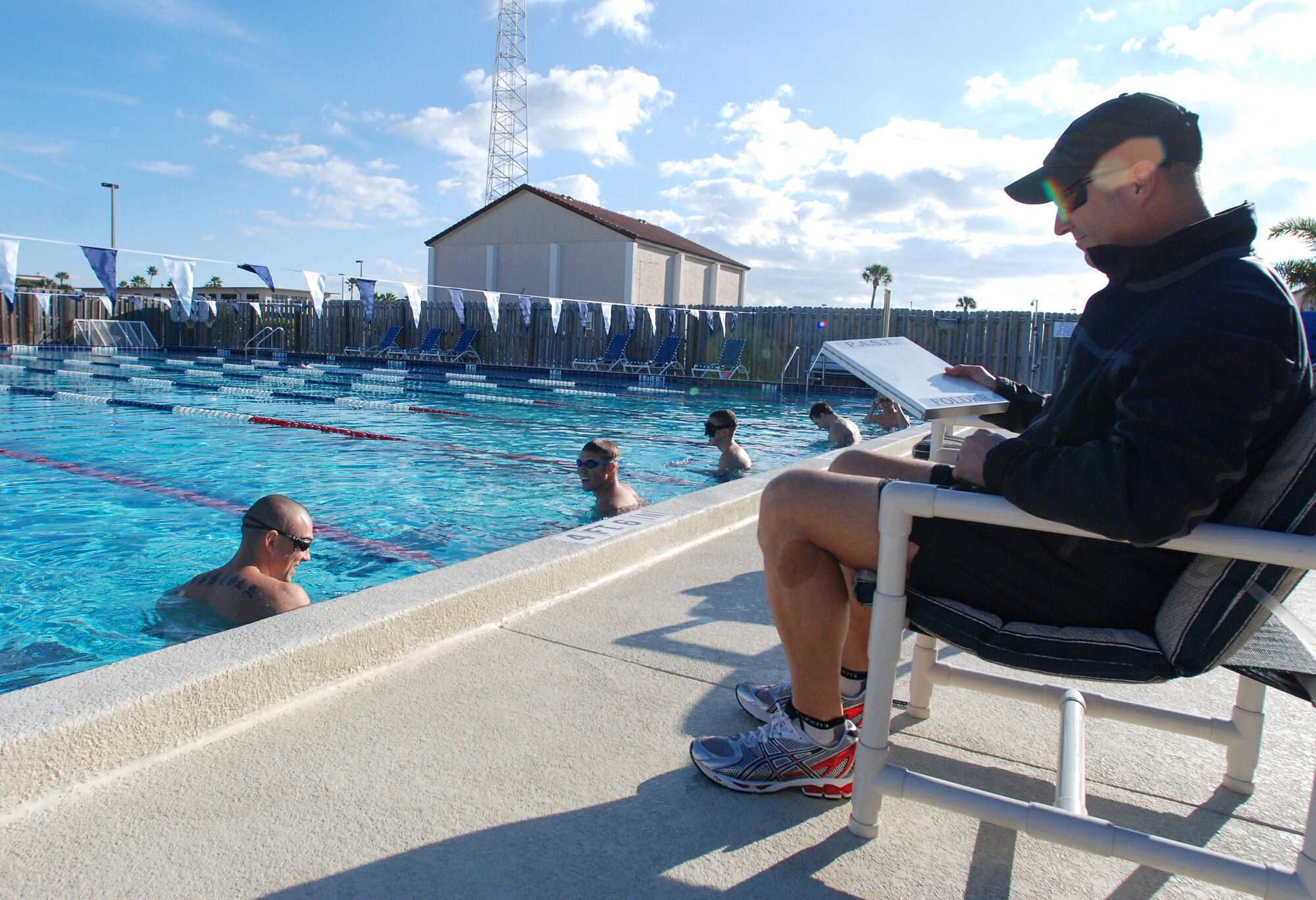 PATRICK AIR FORCE BASE, Fla. - Tech. Sgt. Patrick Dunne gets ready to time the 1,500 meter swim for the P.A.S.T - this is just one qualifer for the passing of the test. Several of these trainees are scheduled to head to INDOC at the beginning of January. (U.S. Air Force Photo/Staff Sgt. Leslie Krausahar)