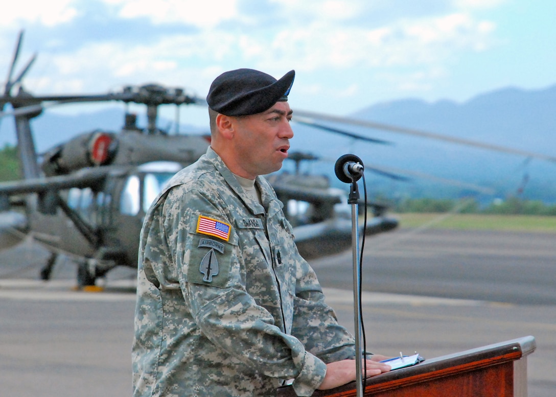 Command Sgt. Maj. Lucio DeAnda assumes responsibilities as the highest ranking enlisted member in 1st Battalion, 228th Aviation Regiment from outgoing 1/228th Command Sgt. Maj. Carlos Escalera Dec. 29 during a change of responsibility ceremony here.  The 1/228th conducts general support aviation operations in support of Joint Task Force-Bravo. (Photo by U.S. Air Force Staff Sgt. Bryan Franks)