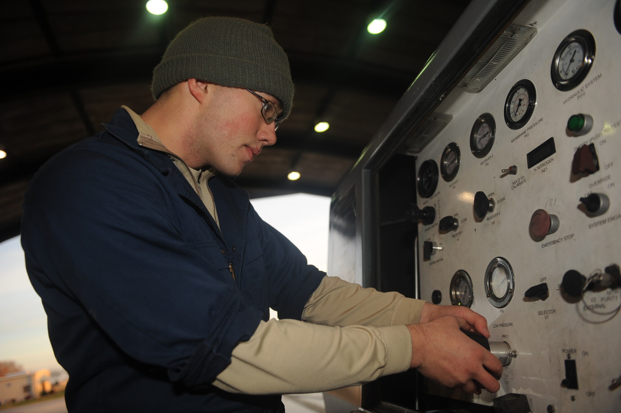 Senior Airman Isaiah Smith, 4th Component Maintenance Squadron aerospace propulsion technician, services a fuel pressure accumulator on Seymour Johnson Air Force Base, N.C., Dec. 17, 2009. Airman Smith's primary duties are to test and troubleshoot engines prior to their installation on an aircraft. (U.S. Air Force photo/Senior Airman Ciara Wymbs) 
