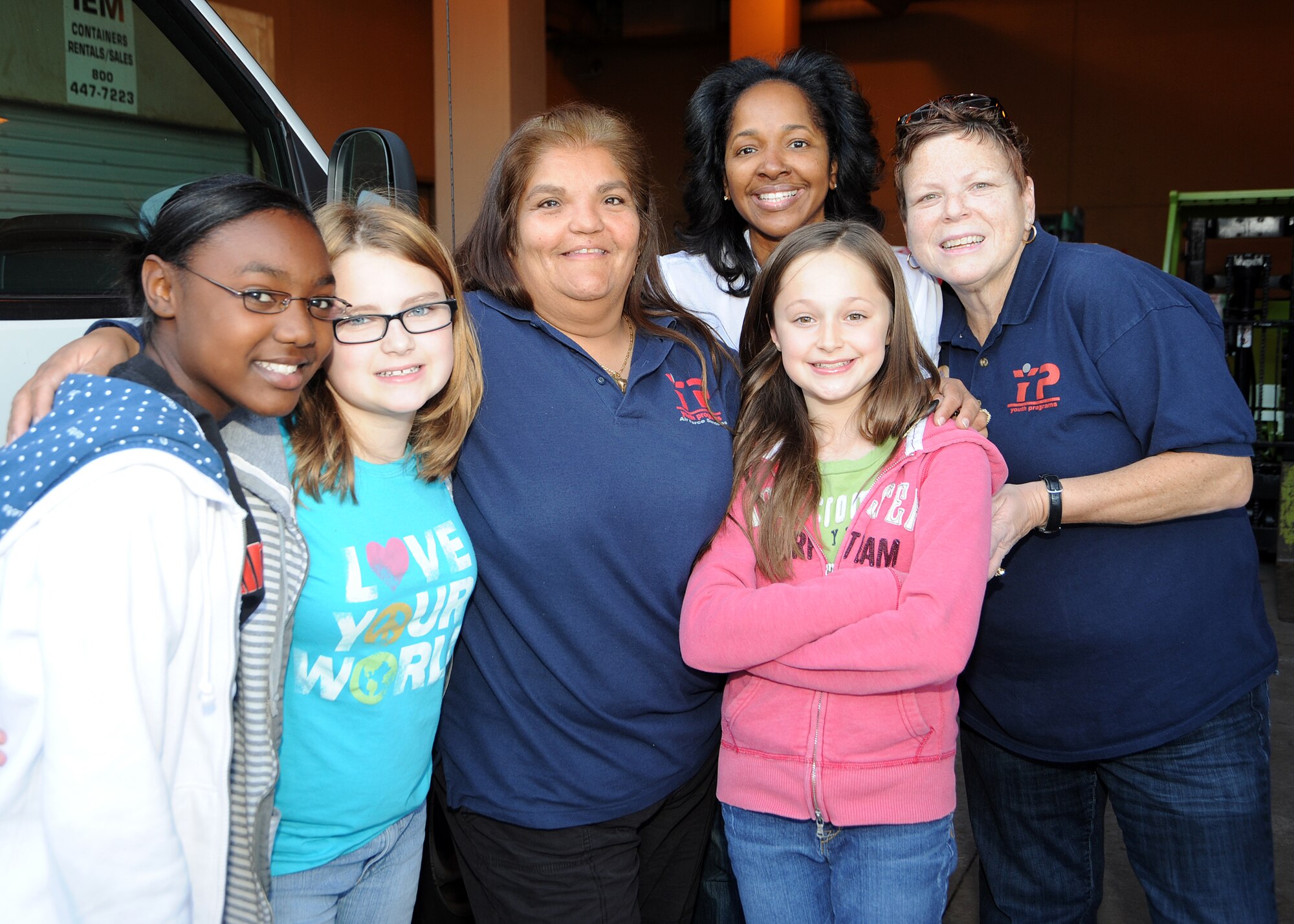 Mission accomplished, (left to right) Maria Simmons, Ashlee Reed, Ester Dulaney (Los Angeles Air Force Base Youth Program recreation assistant), Kitty Davis-Walker (Union Rescue Mission director), Kattie Wesseling and Rebecca Ambro (YP coordinator) “take five” after delivering toys, clothing and baby items to the Union Rescue Mission, Los Angeles, Dec. 18.  Members from the Los Angeles Air Force Base Youth Programs unloaded a van full of items collected through donations from the base’s Airman & Family Readiness Center, the Airmen’s Attic and several families on base. The event was part of YP’s Community Out Reach Program, which teaches youths the importance of humanity and caring for others. (Photo by Joe Juarez)