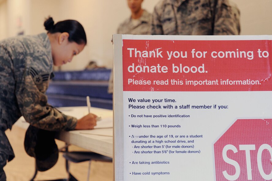 MOODY AIR FORCE BASE, Ga. -- Senior Airman Frances Locquiao, 23rd Wing Public Affairs section chief of internal information, fills out a medical survey before participating in the American Red Cross blood drive here Dec. 22. Before individuals are allowed to donate blood, they are medically screened to ensure the safety of blood they donate as well as the overall blood supply. (U.S. Air Force photo by Airman 1st Class Joshua Green)
