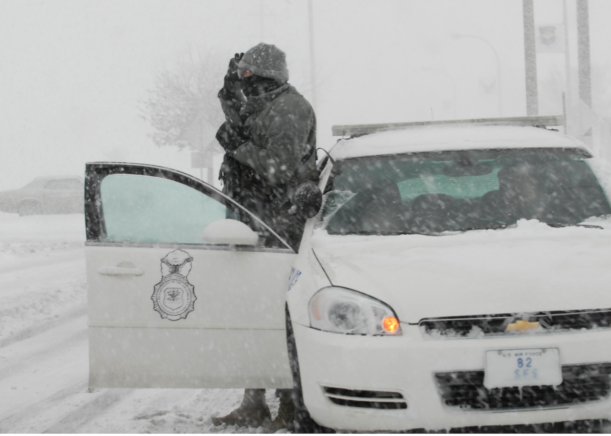 An 82nd Security Forces Squadron Airman works on duty Dec. 24 at Sheppard Air Force Base, Texas, despite blizzard conditions. Mission-essential personnel braved the weather conditions to keep some security, first responder and services running. (U.S. Air Force photo/Harry Tonemah)