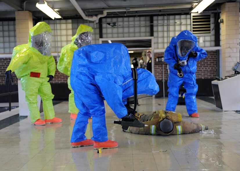 MINOT AIR FORCE BASE, ND – Members of the Army National Guard 81st Civil Support Team check for chemical and radioactive exposure of a “patient” during a recent, joint anti-terrorism exercise held at the Minot Water Treatment Facility, June 3. The exercise involved several agencies, including the base, Bismarck Army National Guard, Minot Fire and Rescue Service, and the Minot Police Department. 2009 was a year that brought progress and a renewed emphasis on safe, secure and reliable nuclear operations. The 91st Missile Wing transitioned to Air Force Global Strike Command with the 5th Bomb Wing scheduled to follow suit in 2010. (US Air Force photo by Staff Sgt. Keith Ballard)