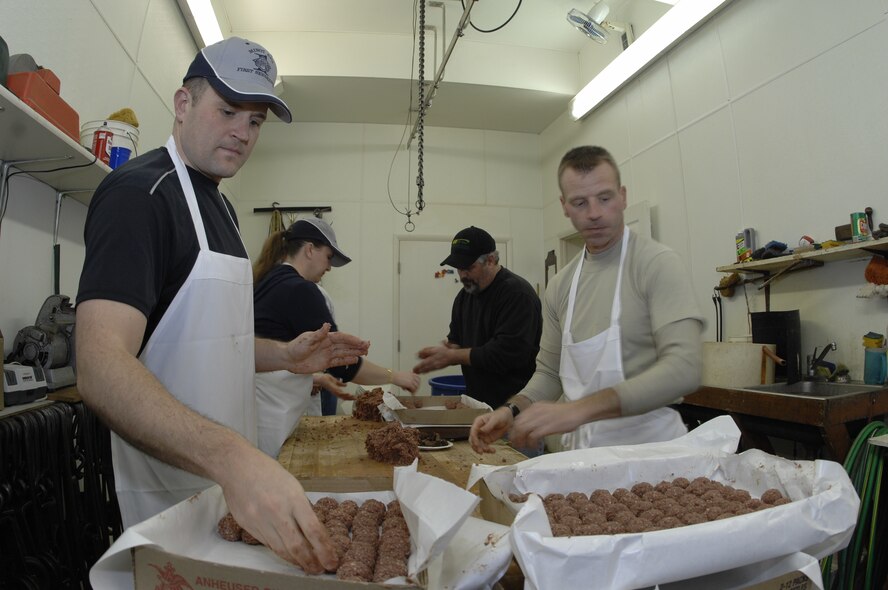 MINOT AIR FORCE BASE, N.D. -- First Sergeants from here prepare meat at Blom’s Locker in Minot in preparation for the 2009 annual sportsmen’s feed. 2009 was a year that brought progress and a renewed  emphasis on safe, secure and reliable nuclear operations. The 91st Missile Wing transitioned to Air Force Global Strike Command with the 5th Bomb Wing scheduled to follow suit in 2010. (U.S. Air Force photo by Airman 1st Class Benjamin Stratton)